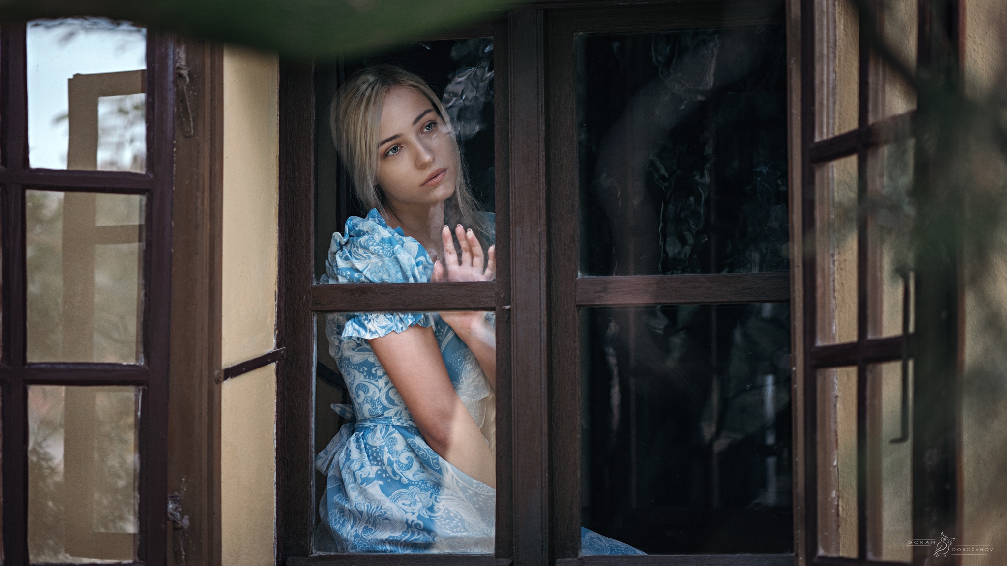 Contemplative Blonde Woman by Window HD Wallpaper