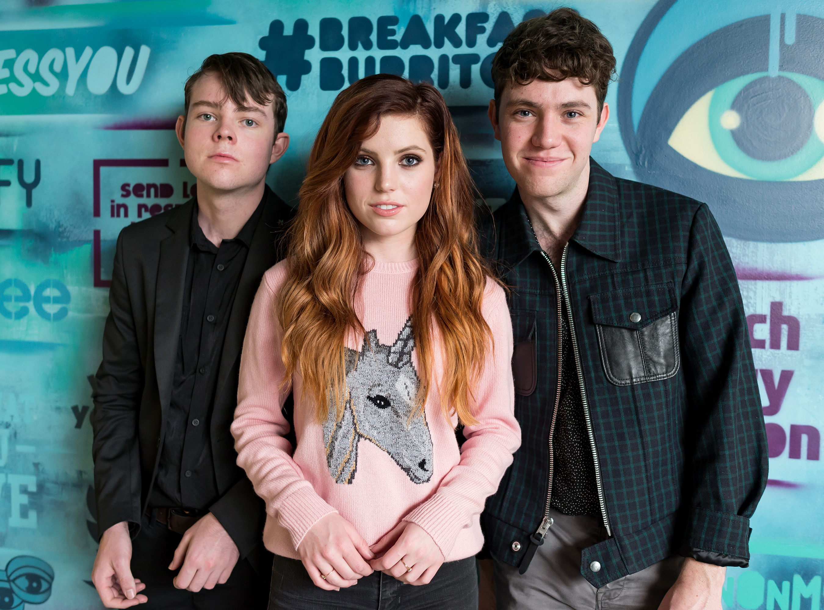 Echosmith band members posing in front of graffiti wall HD Wallpaper