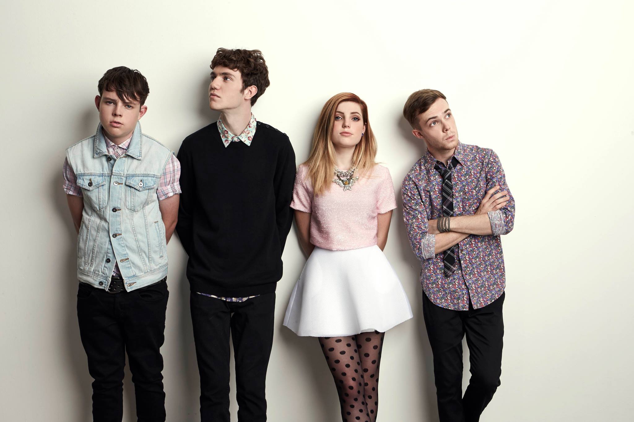 Echosmith band members posing against a wall HD Wallpaper