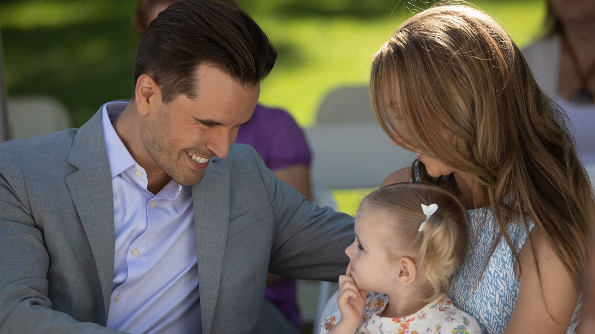 Family at an outdoor event HD Wallpaper