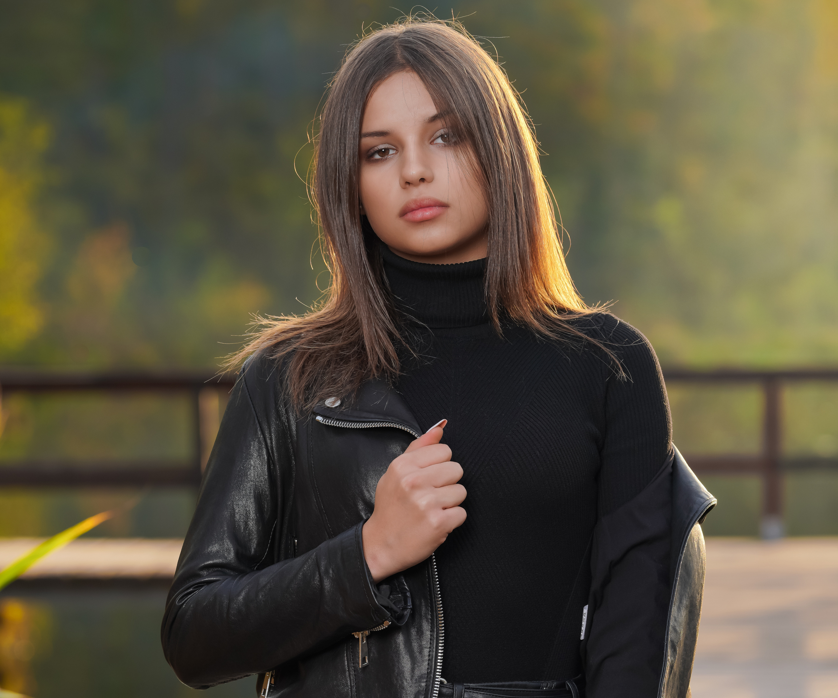 Woman with brown hair wearing a leather jacket HD Wallpaper
