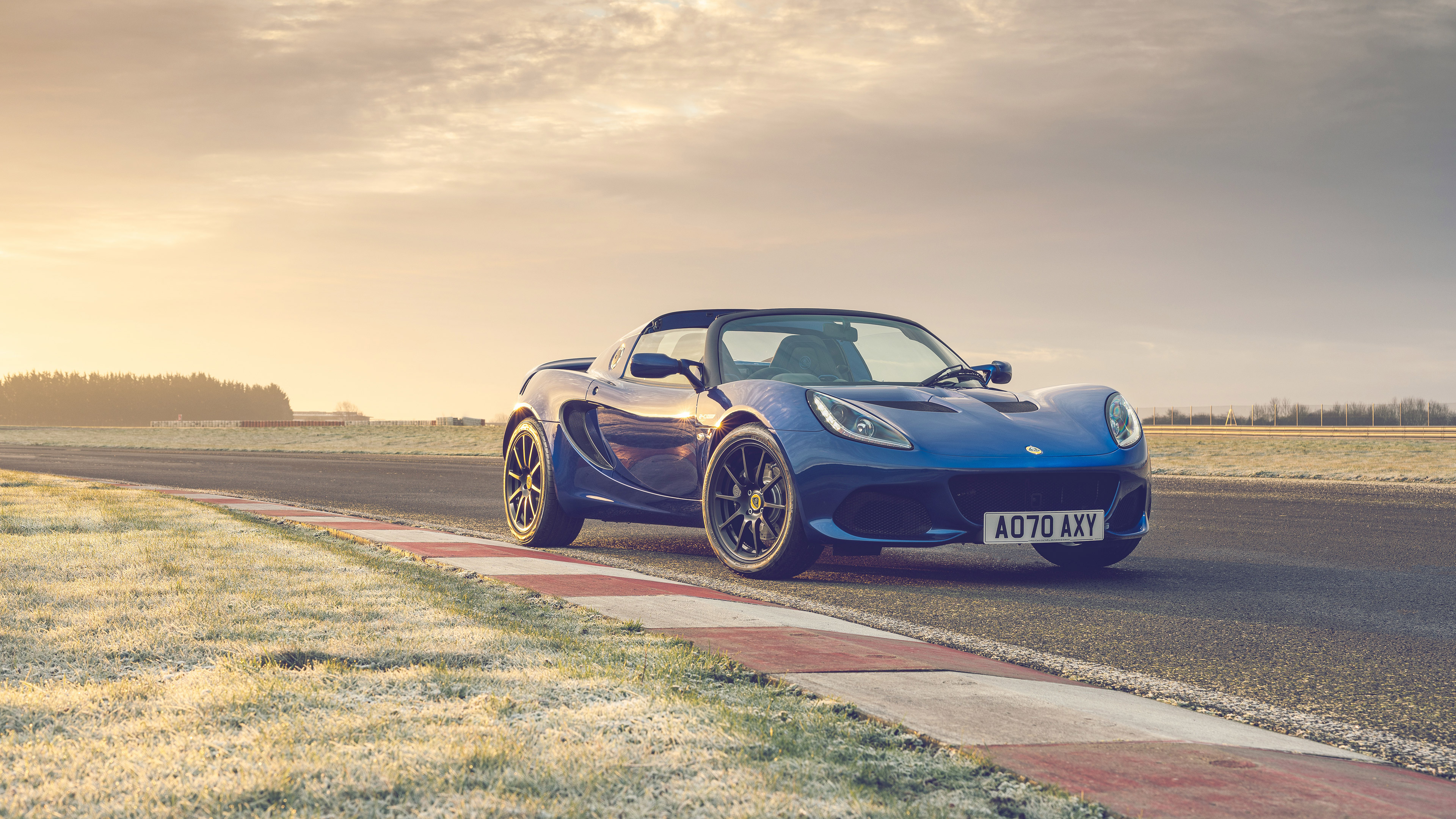 Blue Lotus Elise Sport 240 on a race track HD Wallpaper