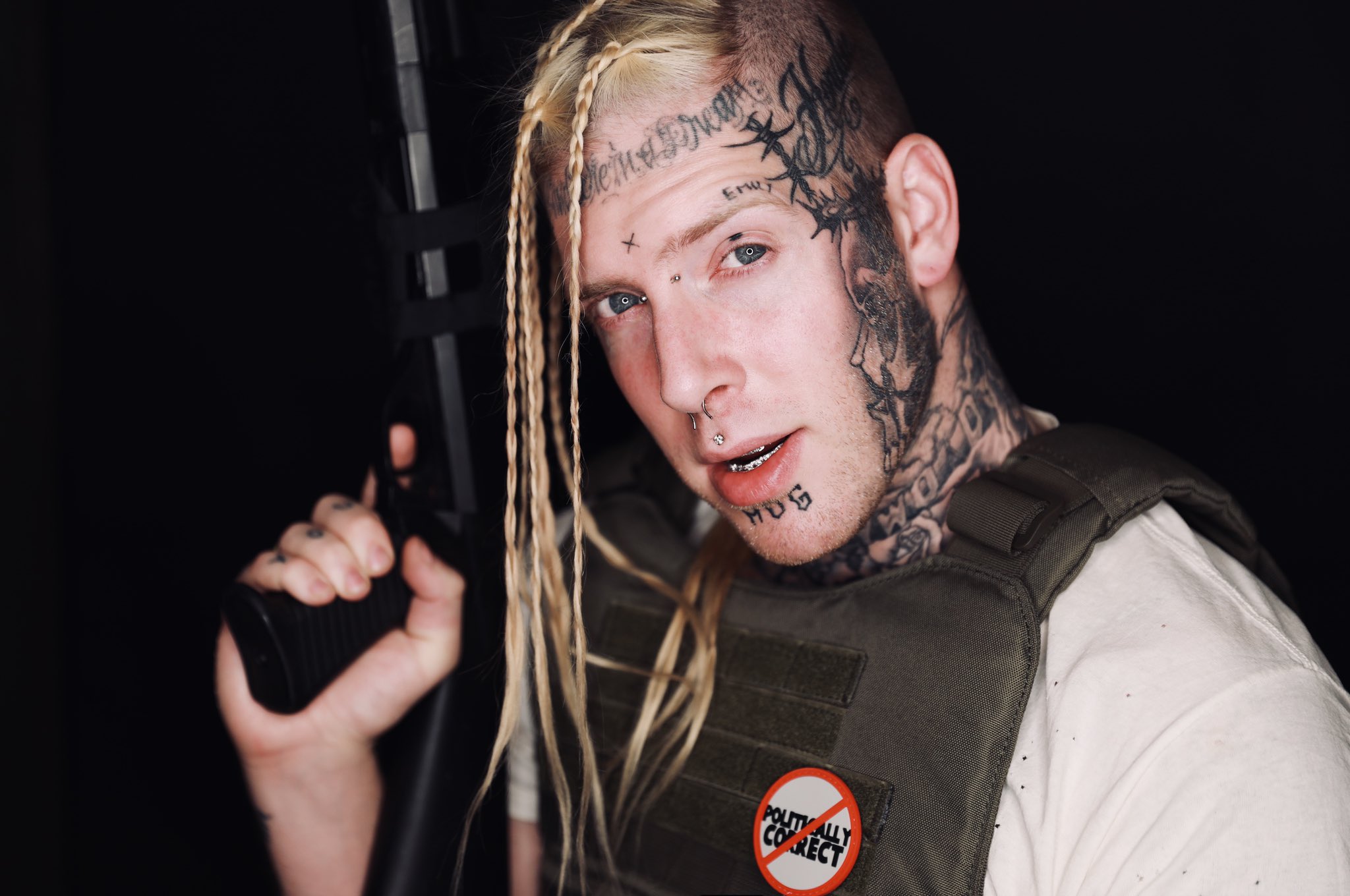 Tom MacDonald with a gun HD Wallpaper