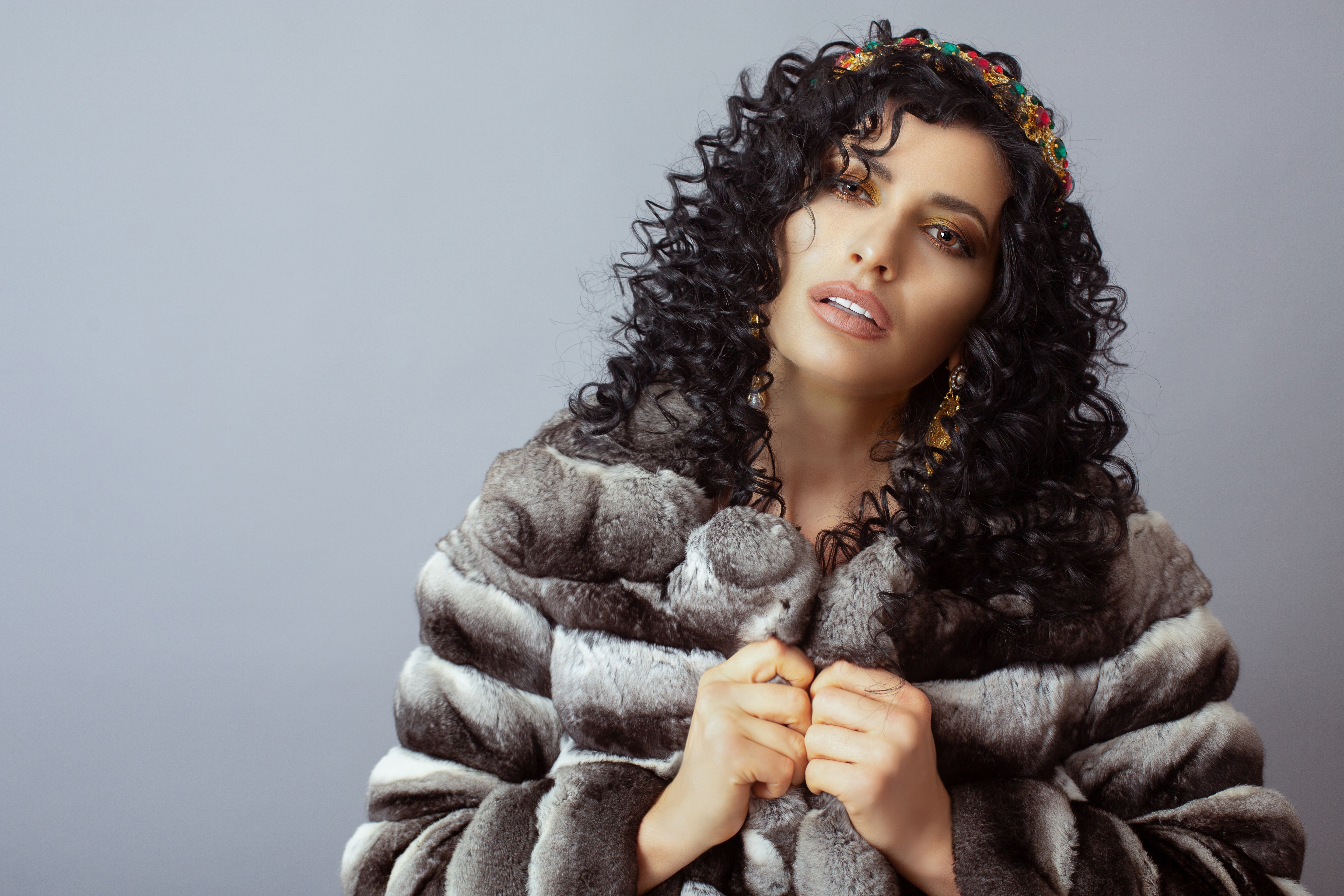 Woman with Black Curly Hair and Fur Coat HD Wallpaper