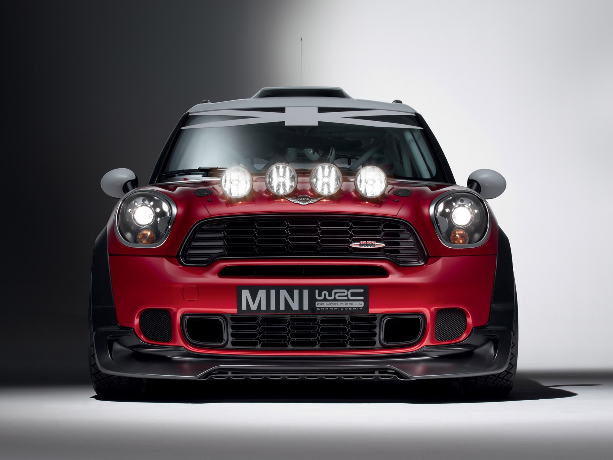 Red Mini WRC Rally Car with Auxiliary Lights HD Wallpaper