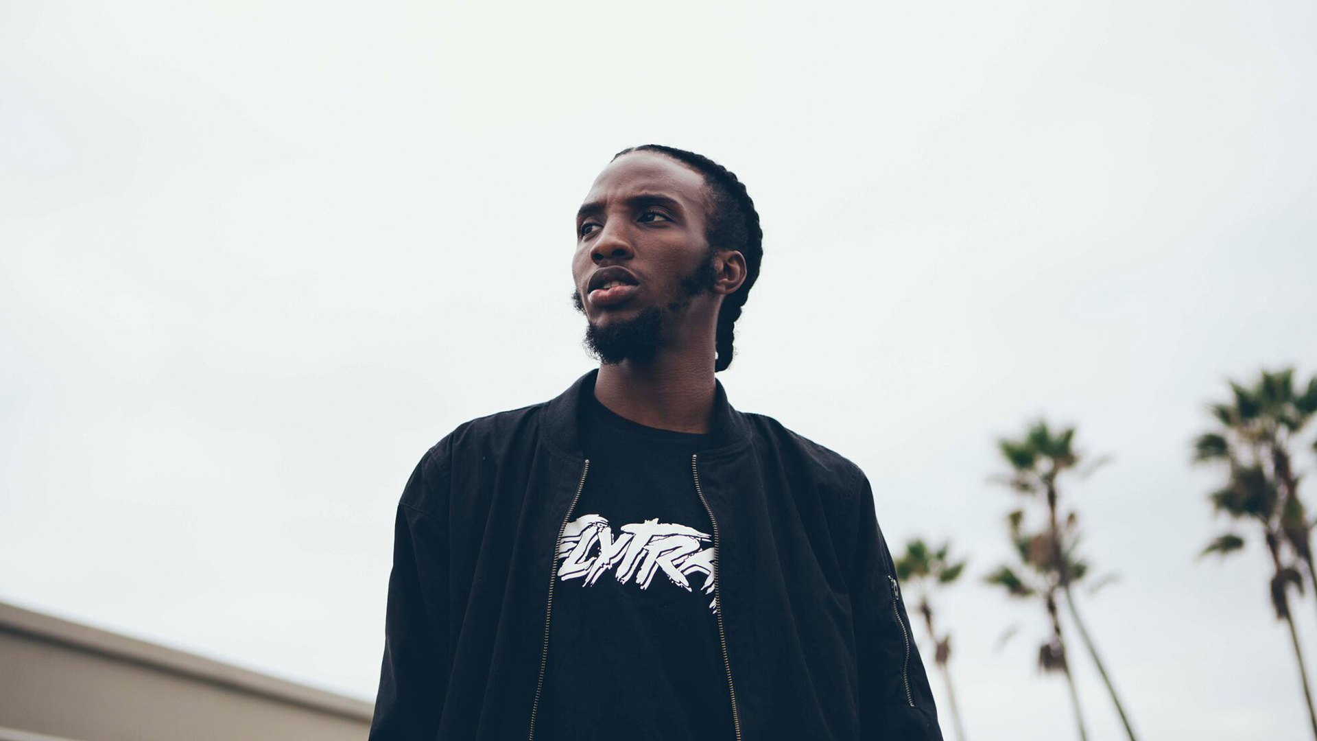 CJ Fly wearing a bomber jacket and t-shirt HD Wallpaper