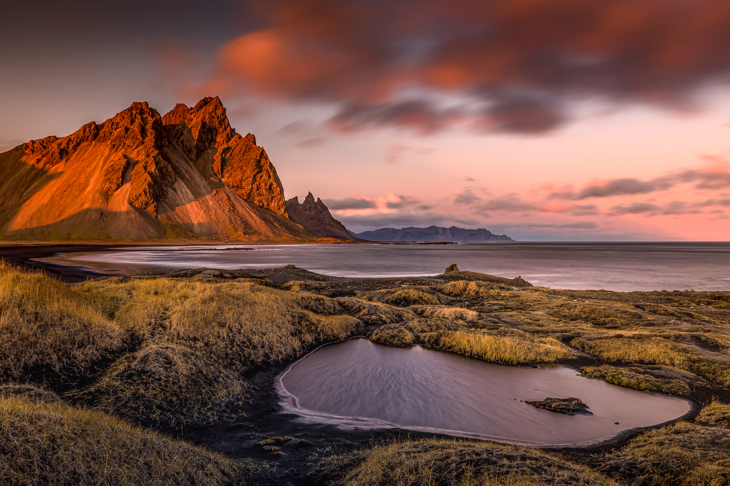Mountain range by the sea at sunset HD Wallpaper