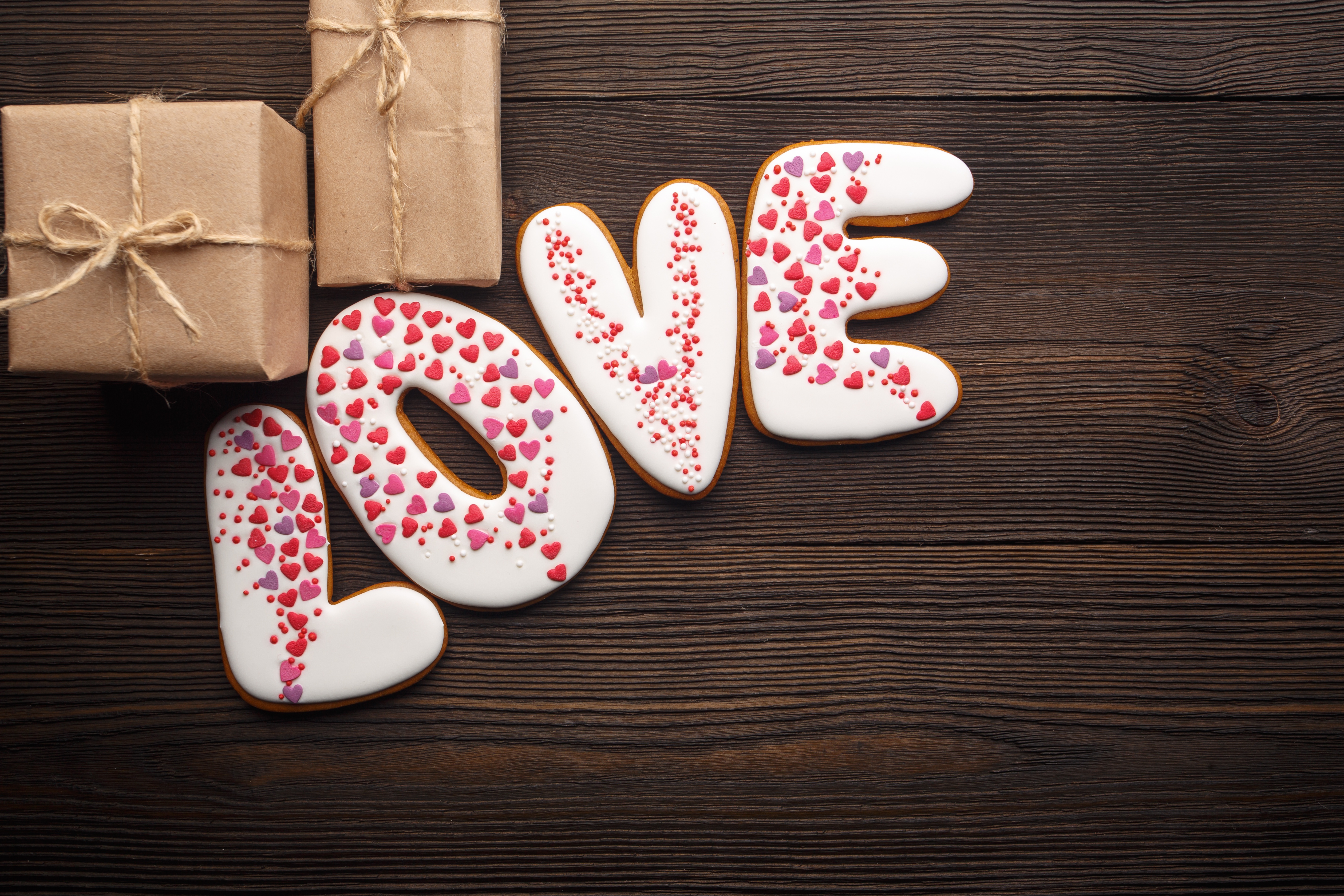 Love cookies and gifts on wooden background HD Wallpaper
