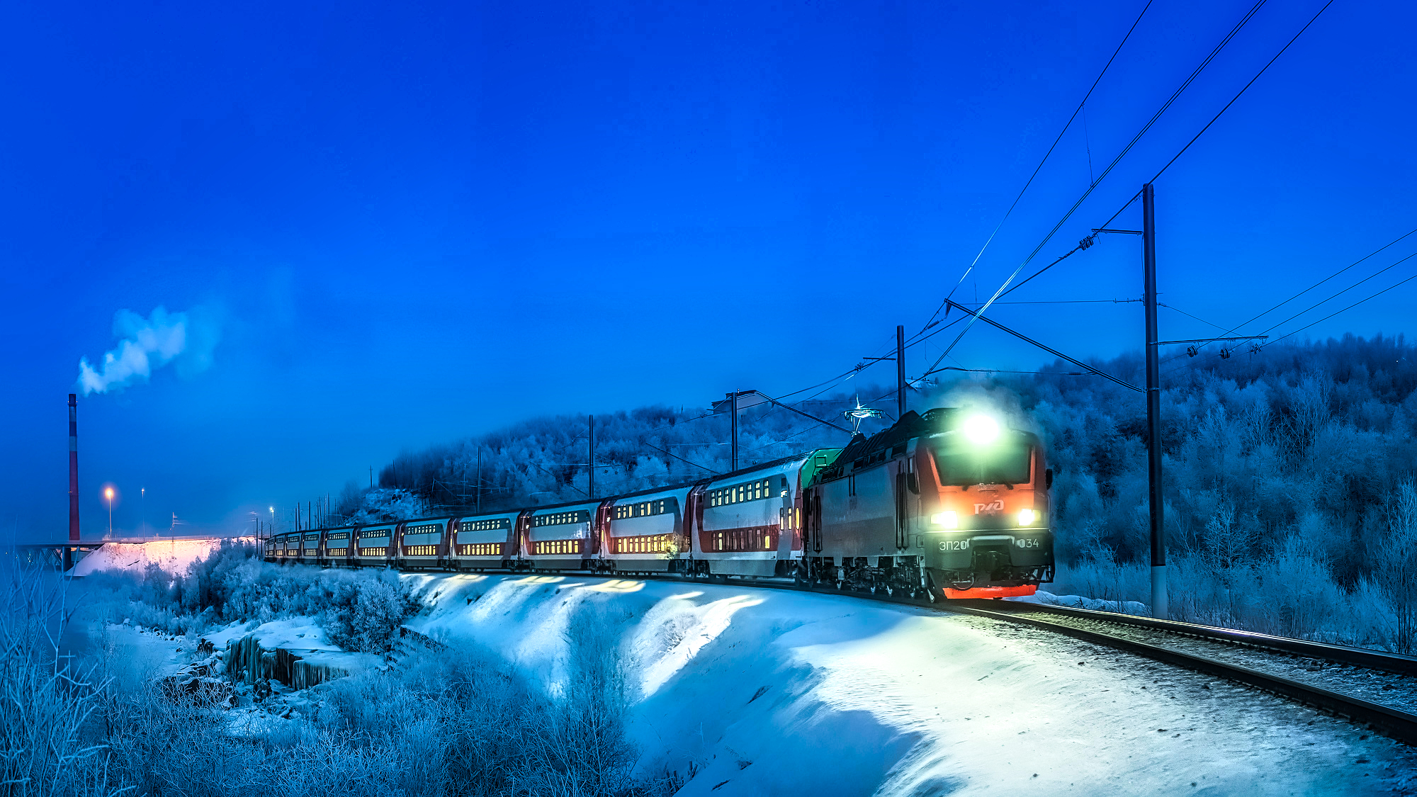 Passenger train in snow at night HD Wallpaper