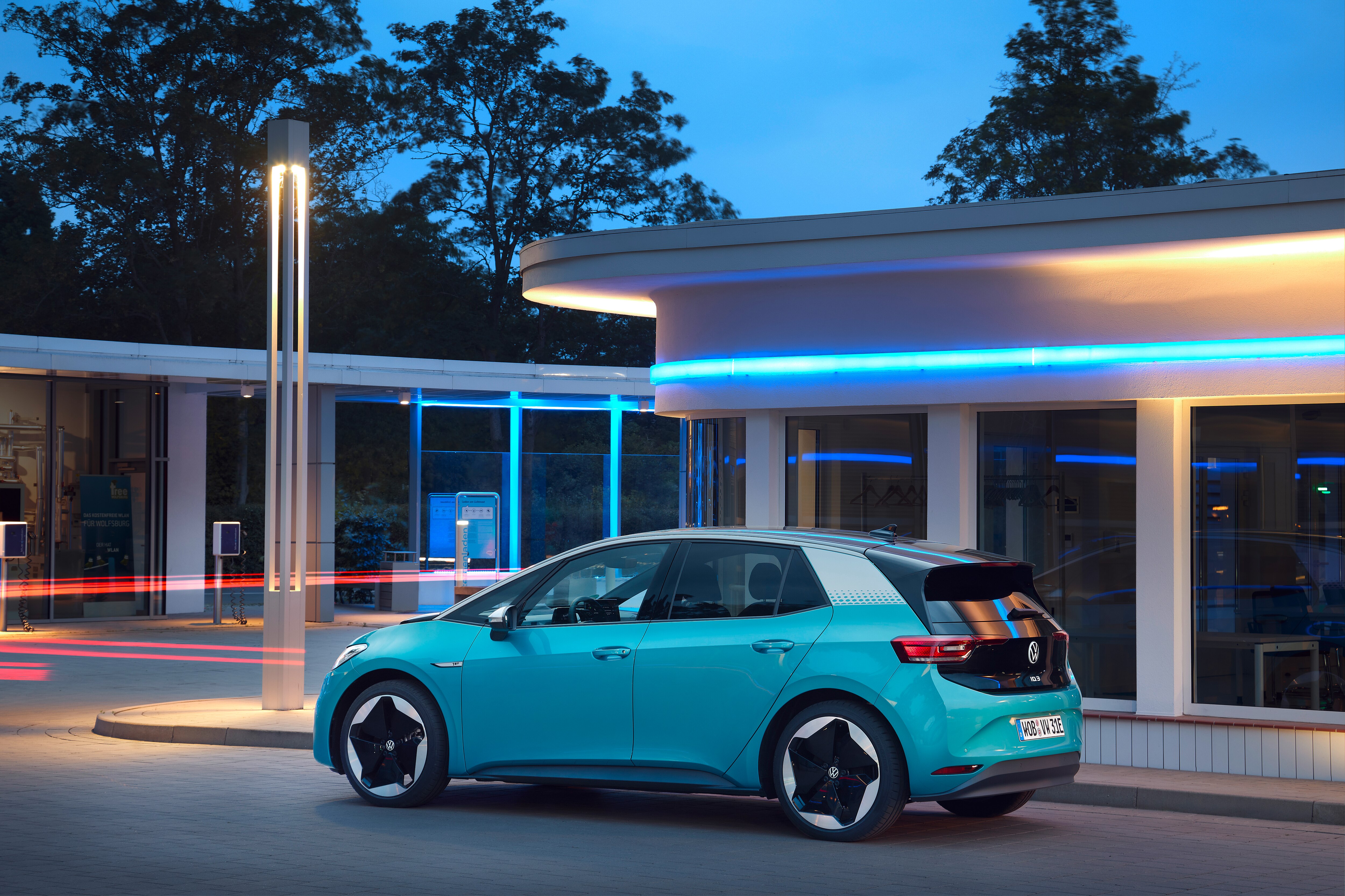 Blue Volkswagen ID.3 electric car at charging station HD Wallpaper