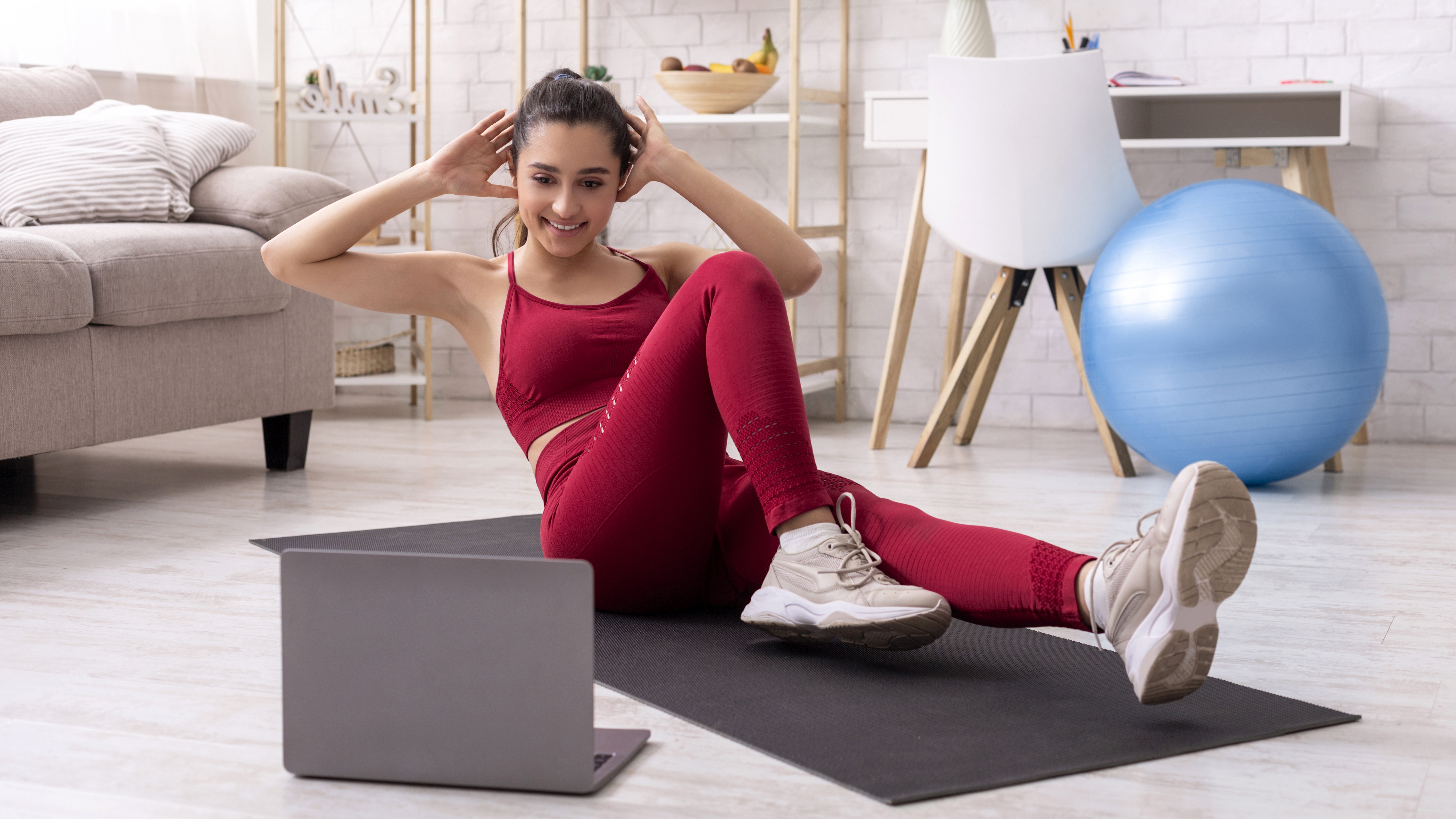 Woman doing crunches at home HD Wallpaper