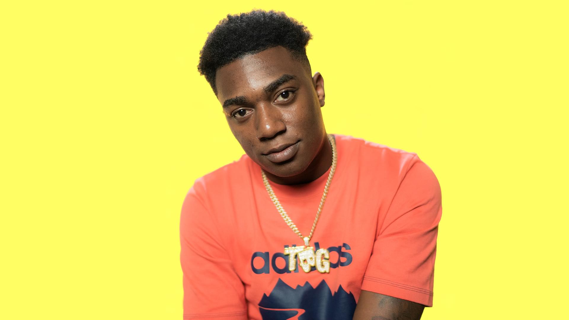 Fredo Bang wearing an orange Adidas shirt HD Wallpaper