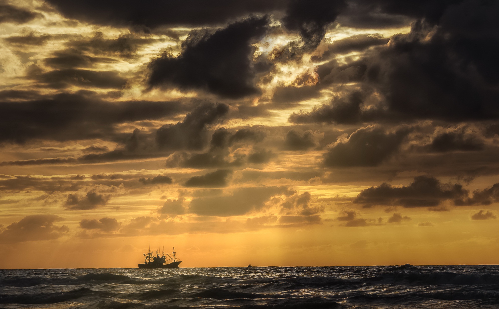 Fishing boat on the sea at sunset HD Wallpaper