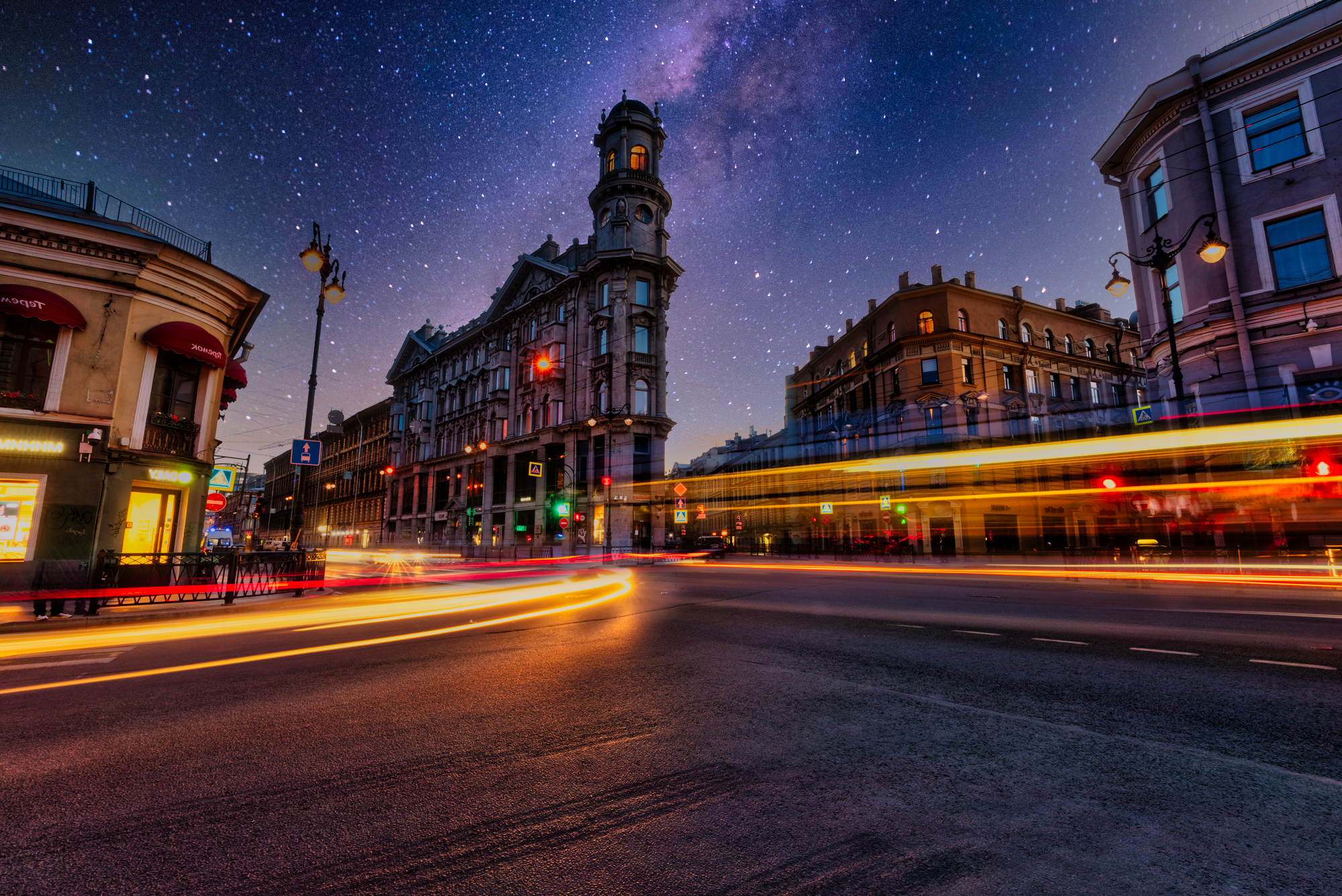Night city street with light trails and starry sky HD Wallpaper