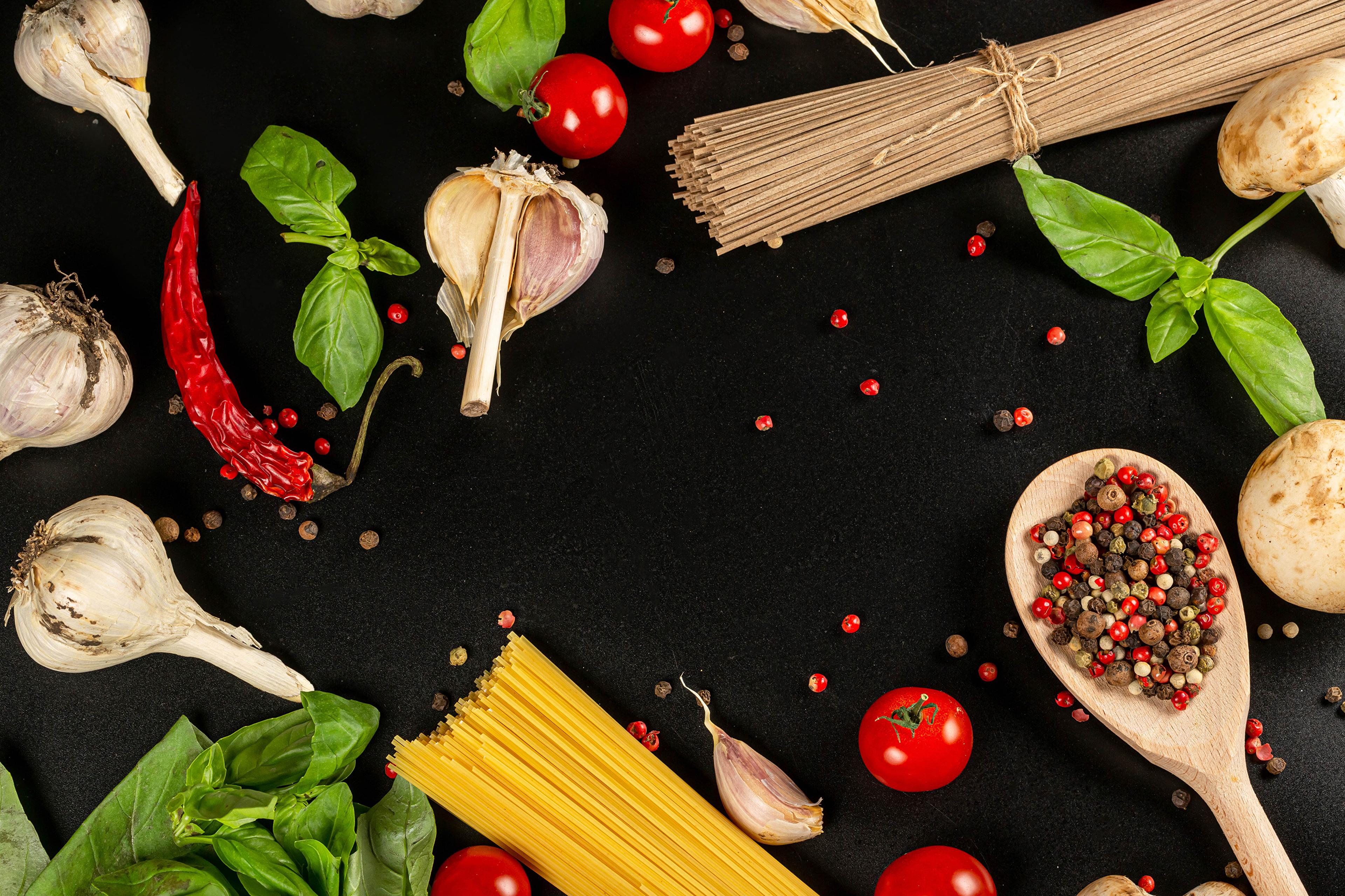 Pasta ingredients with garlic, tomatoes, and spices HD Wallpaper