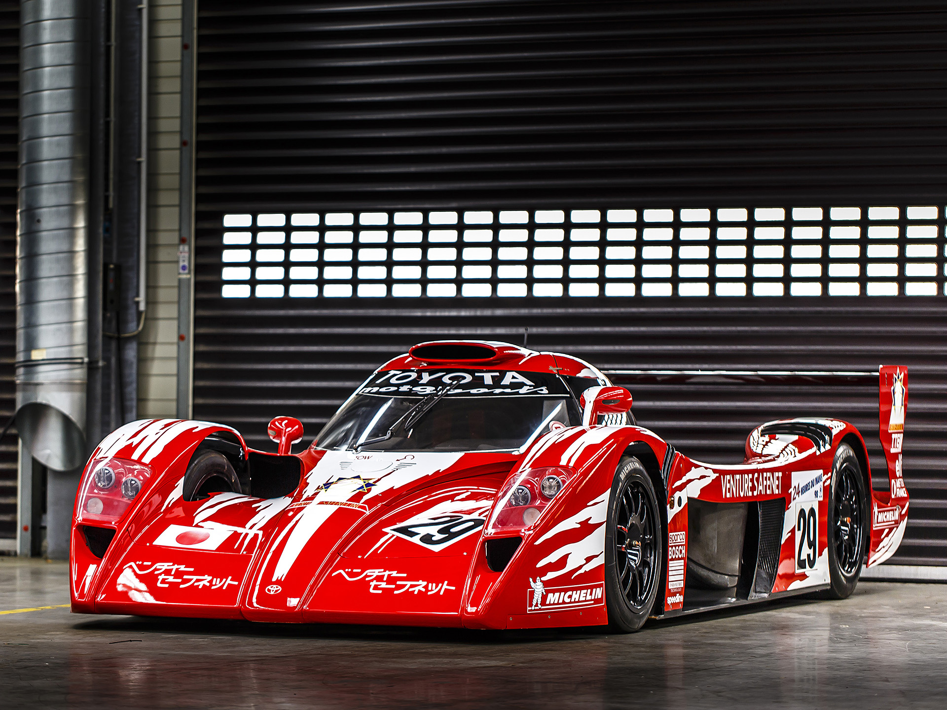 Red Toyota GT One race car with Japanese flag HD Wallpaper