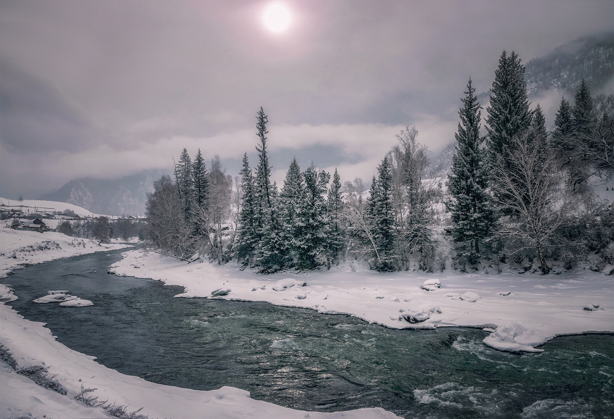 River in a snowy landscape with trees and mountains HD Wallpaper
