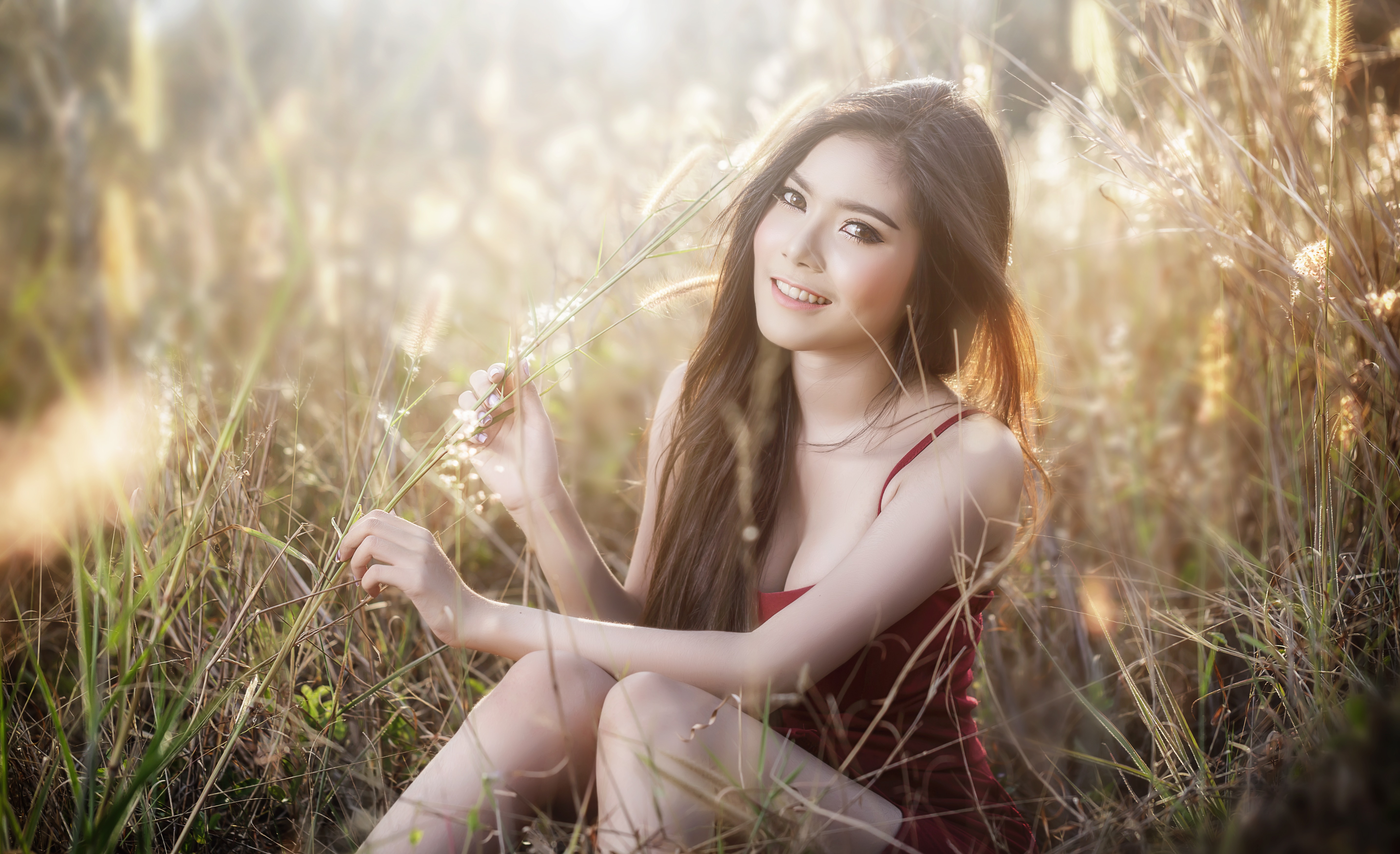 Asian Woman with Long Brunette Hair Smiling in Field HD Wallpaper