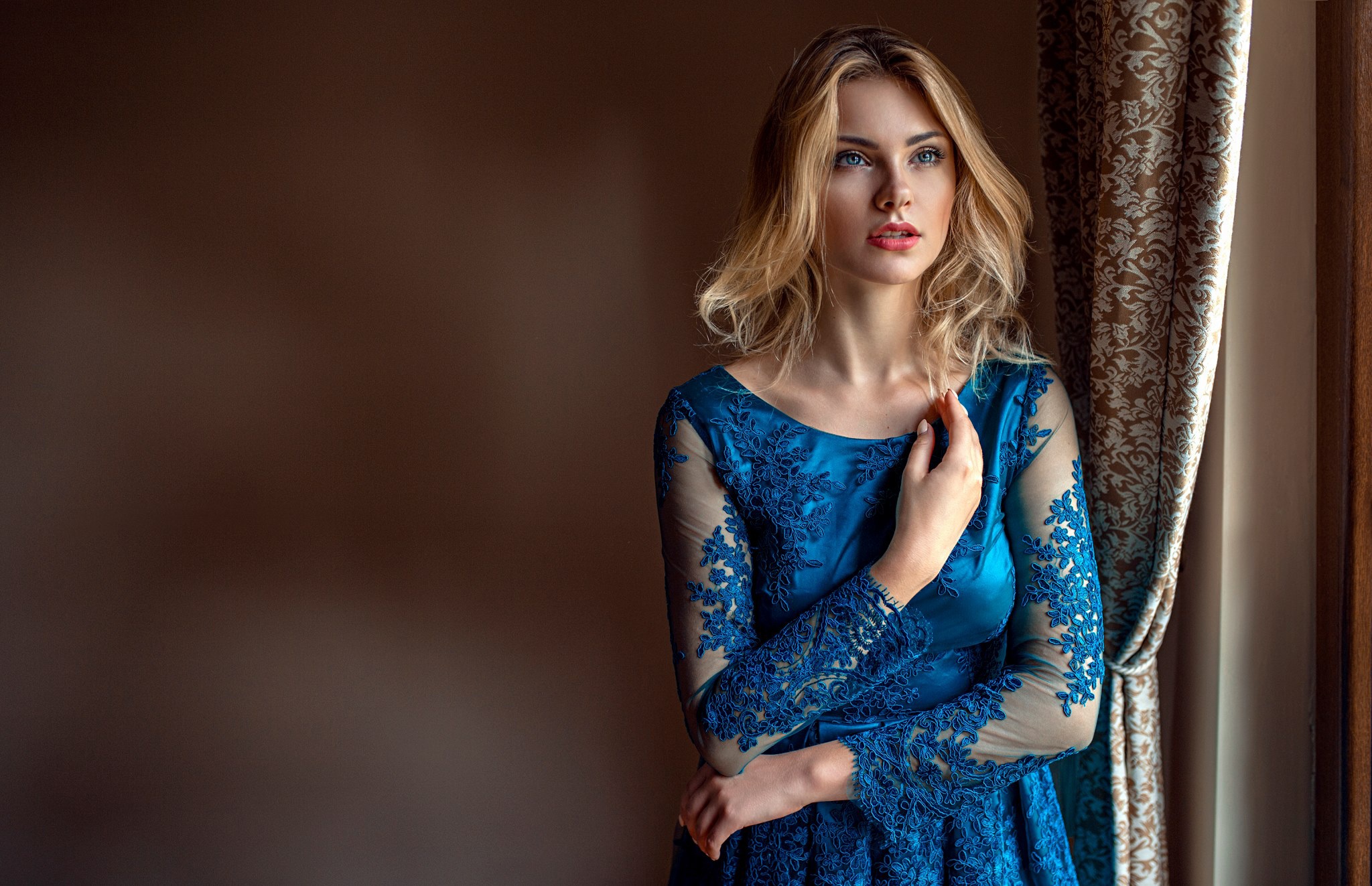 Woman in a blue dress by the window HD Wallpaper