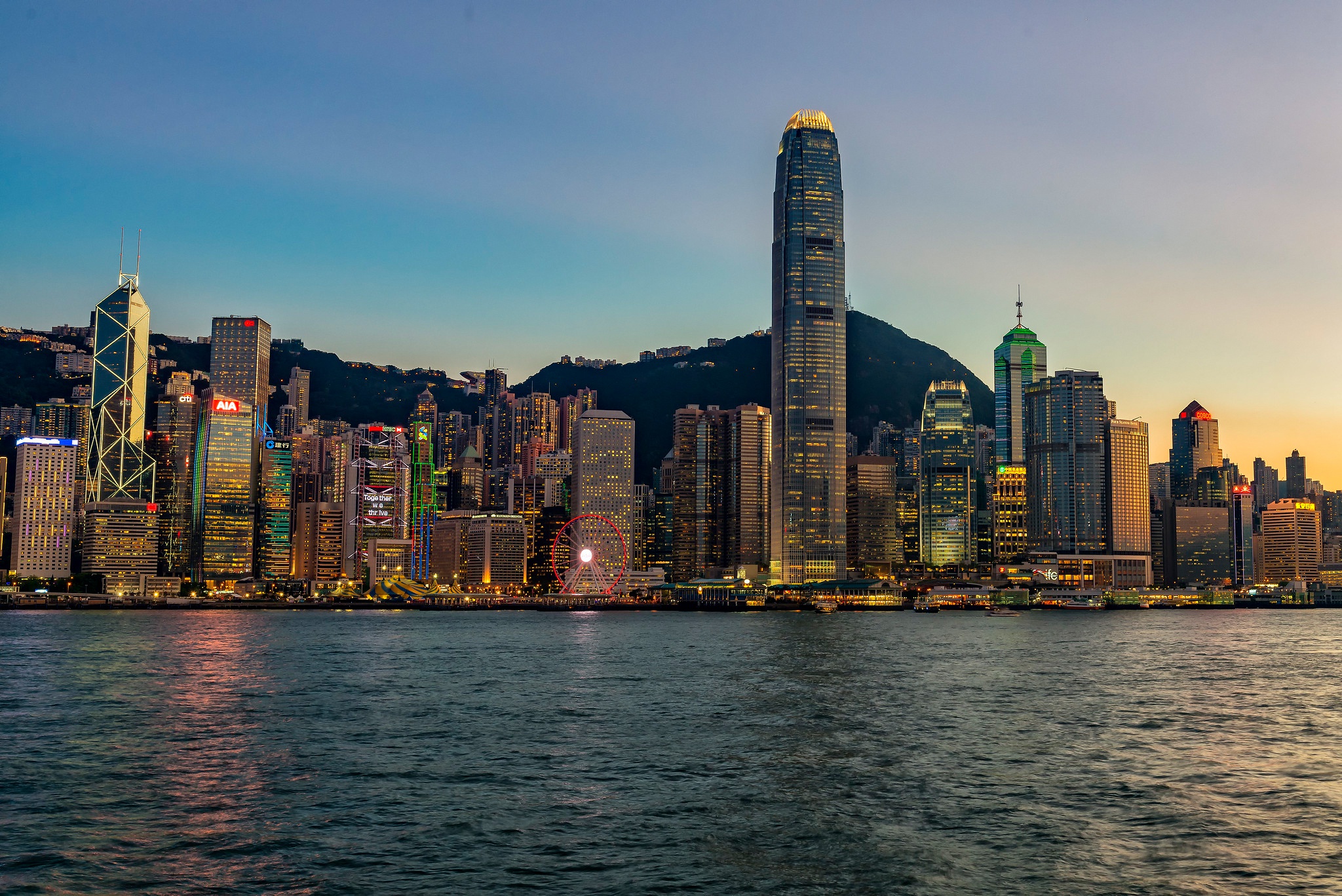 Hong Kong skyline at dusk with Victoria Harbour HD Wallpaper