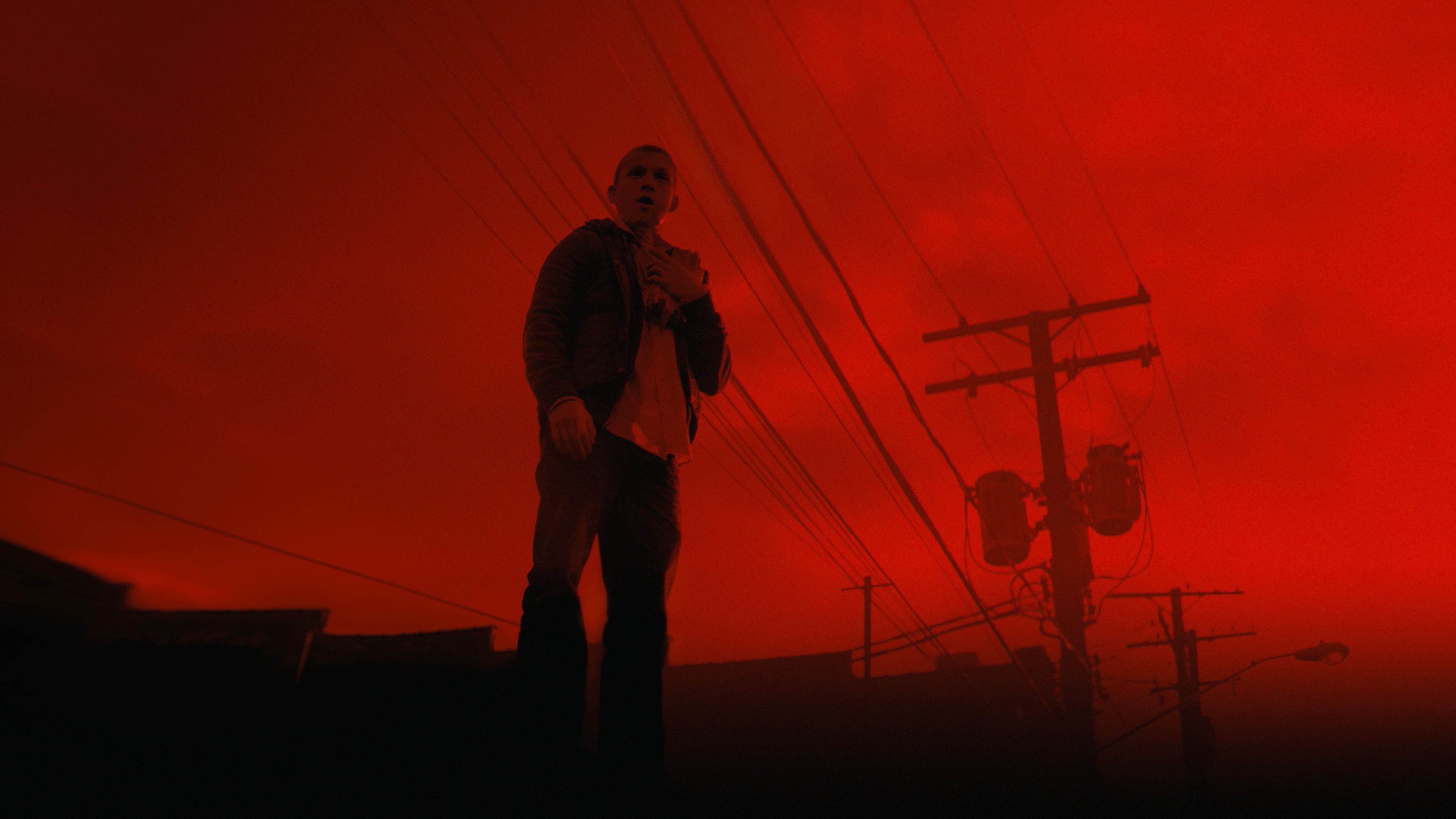 Man in red sky with power lines HD Wallpaper