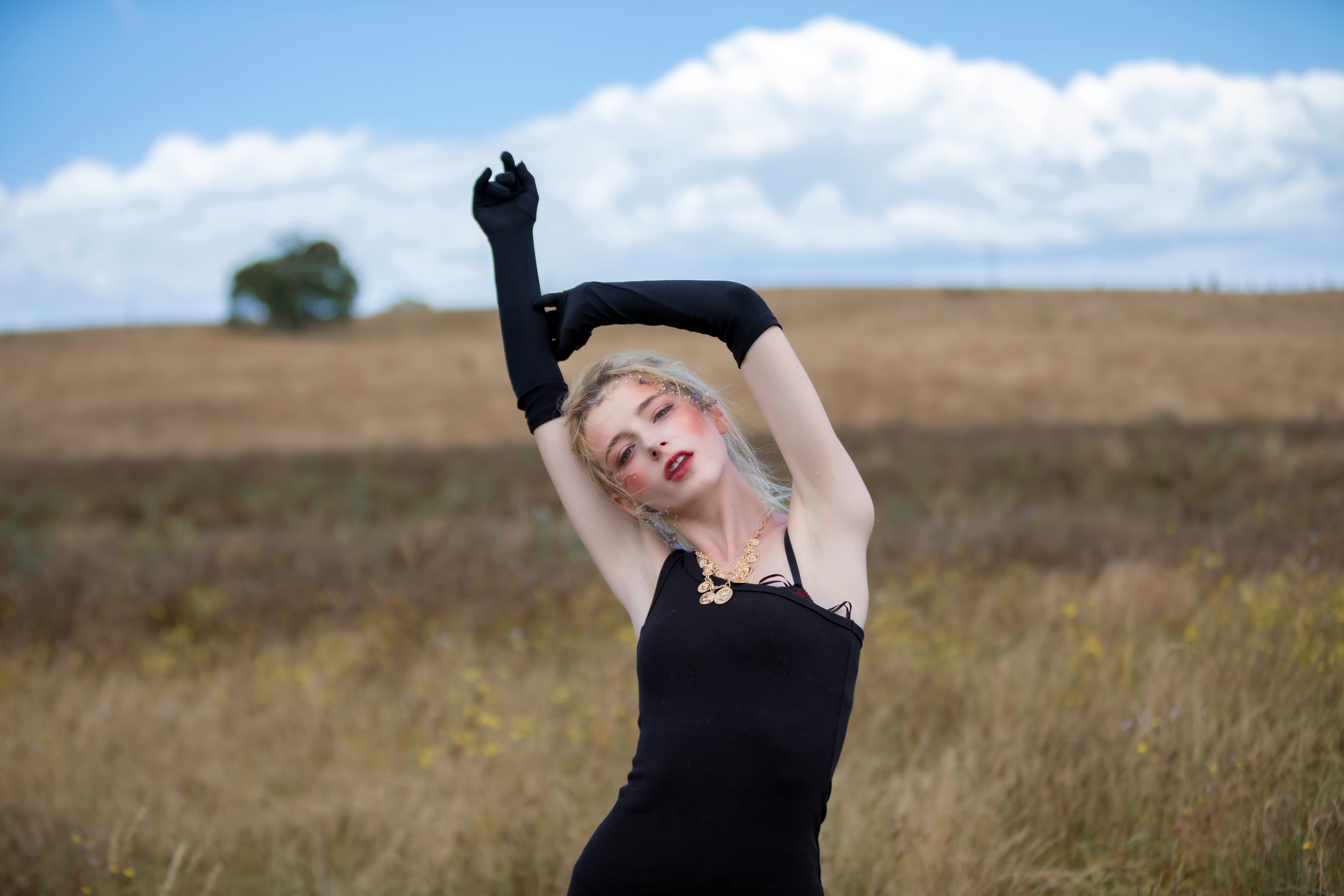 Woman in Black Dress with Blonde Hair HD Wallpaper