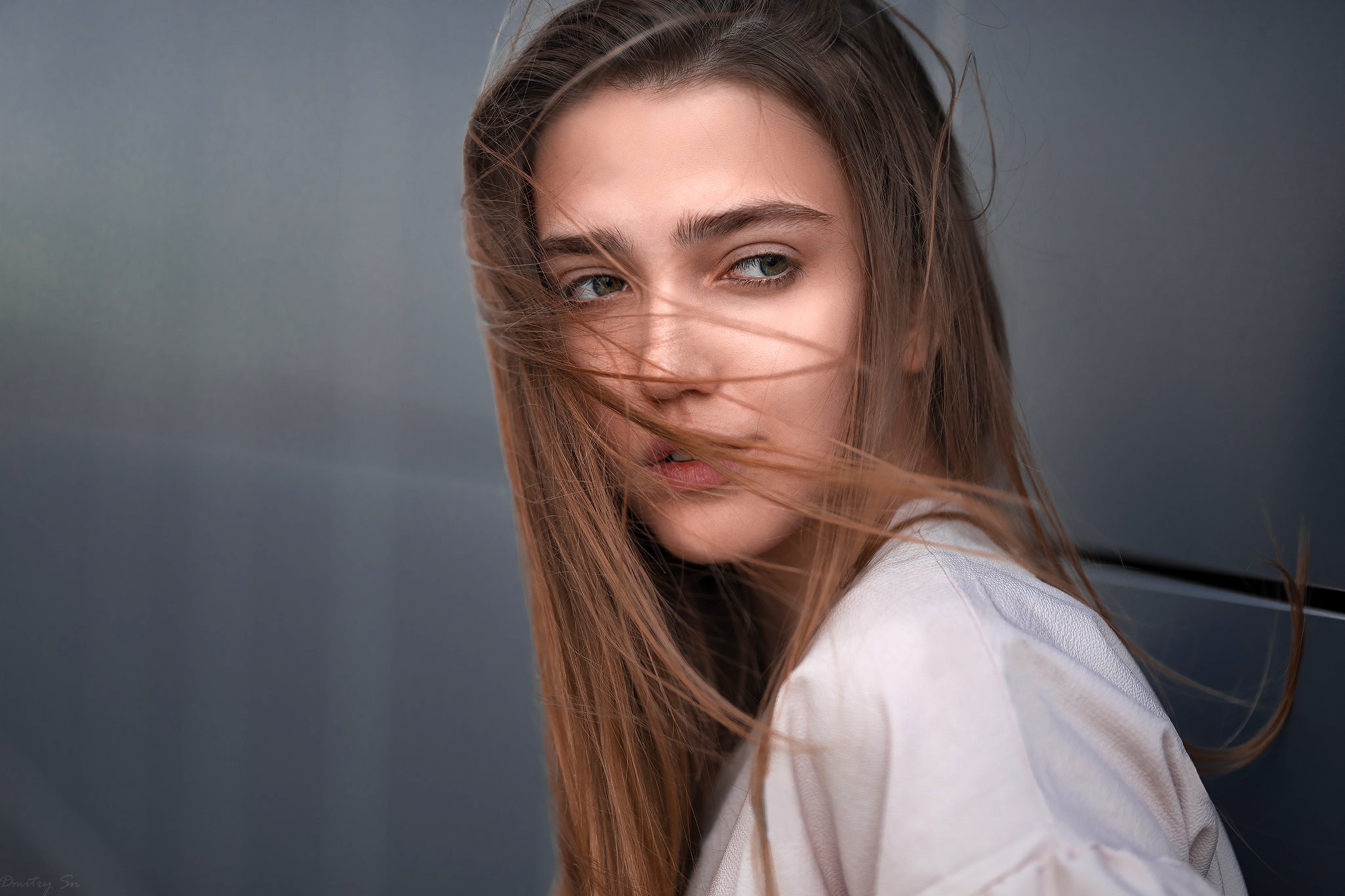 Woman with brown hair blowing in the wind HD Wallpaper