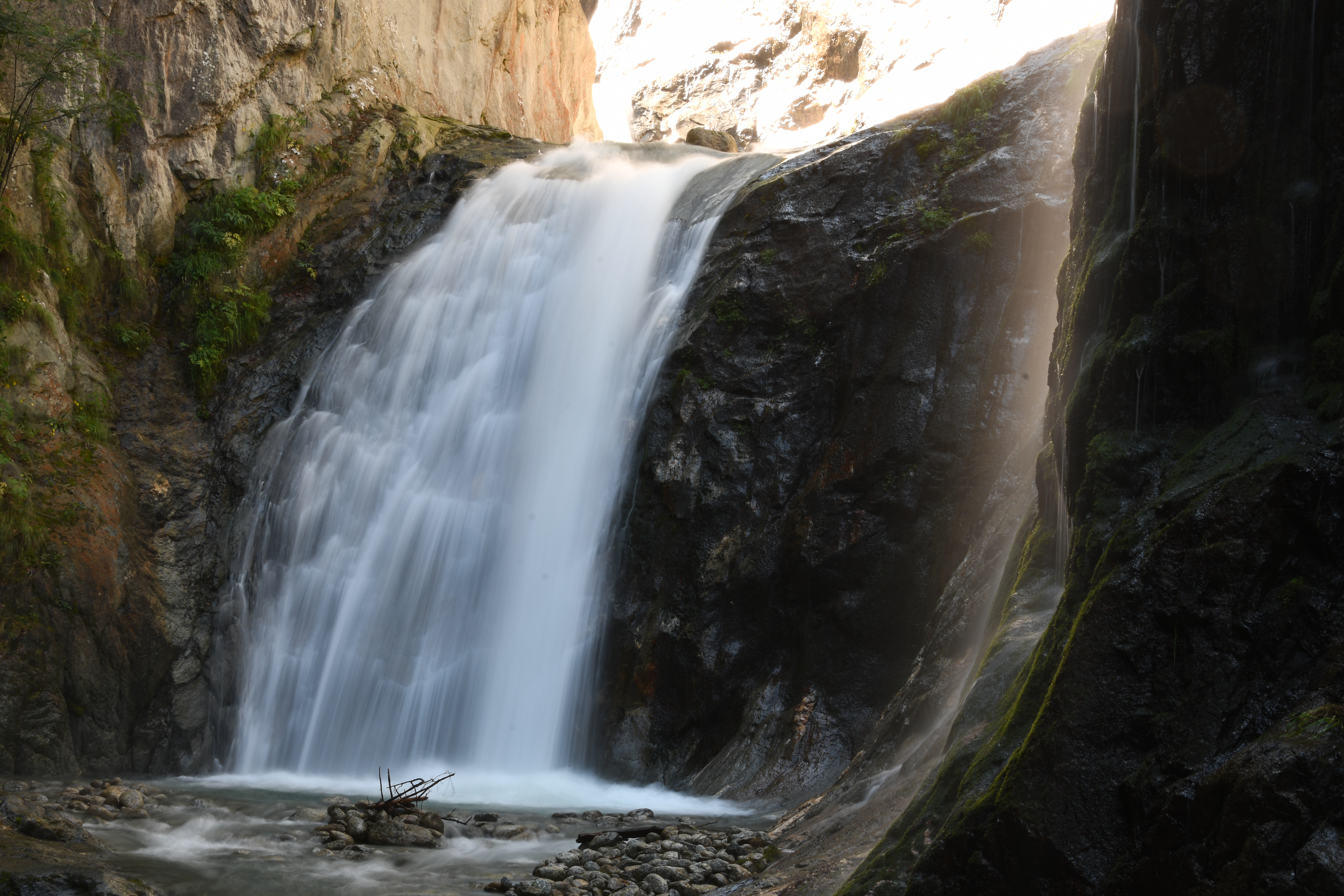 Waterfall in a rocky canyon HD Wallpaper