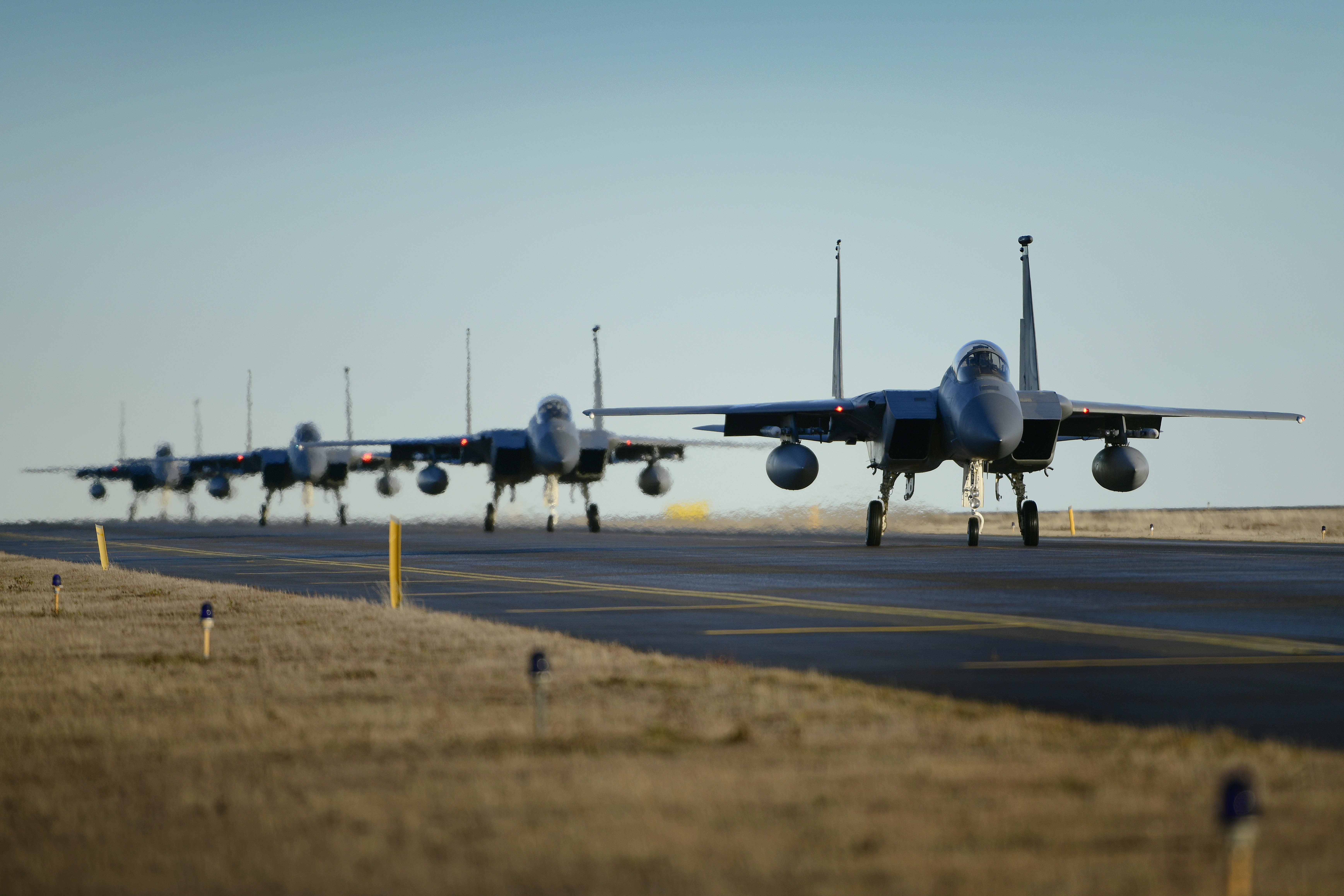 McDonnell Douglas F-15 Eagle fighter jets on runway HD Wallpaper