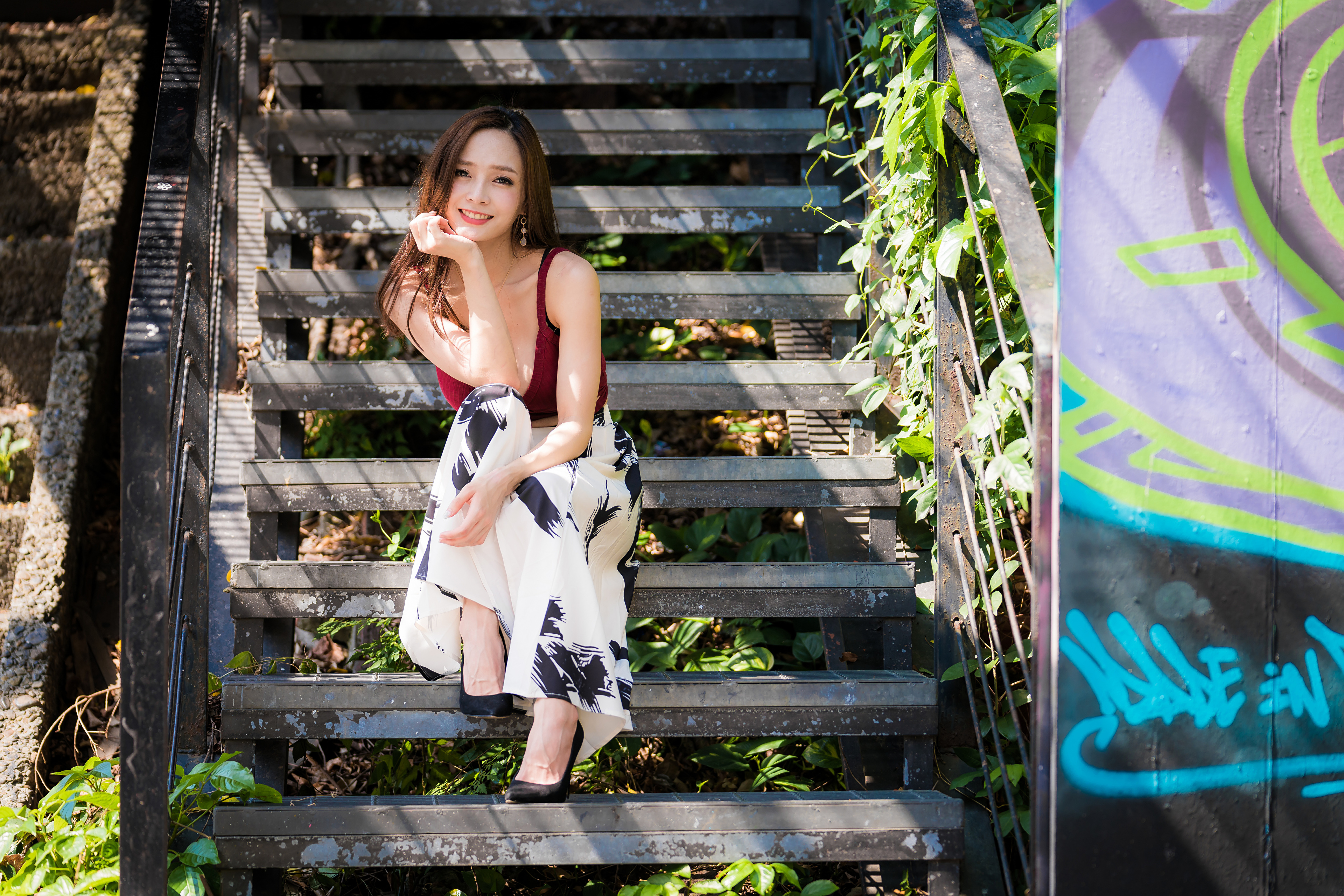 Asian Woman Smiling on Outdoor Stairs 4K HD Wallpaper