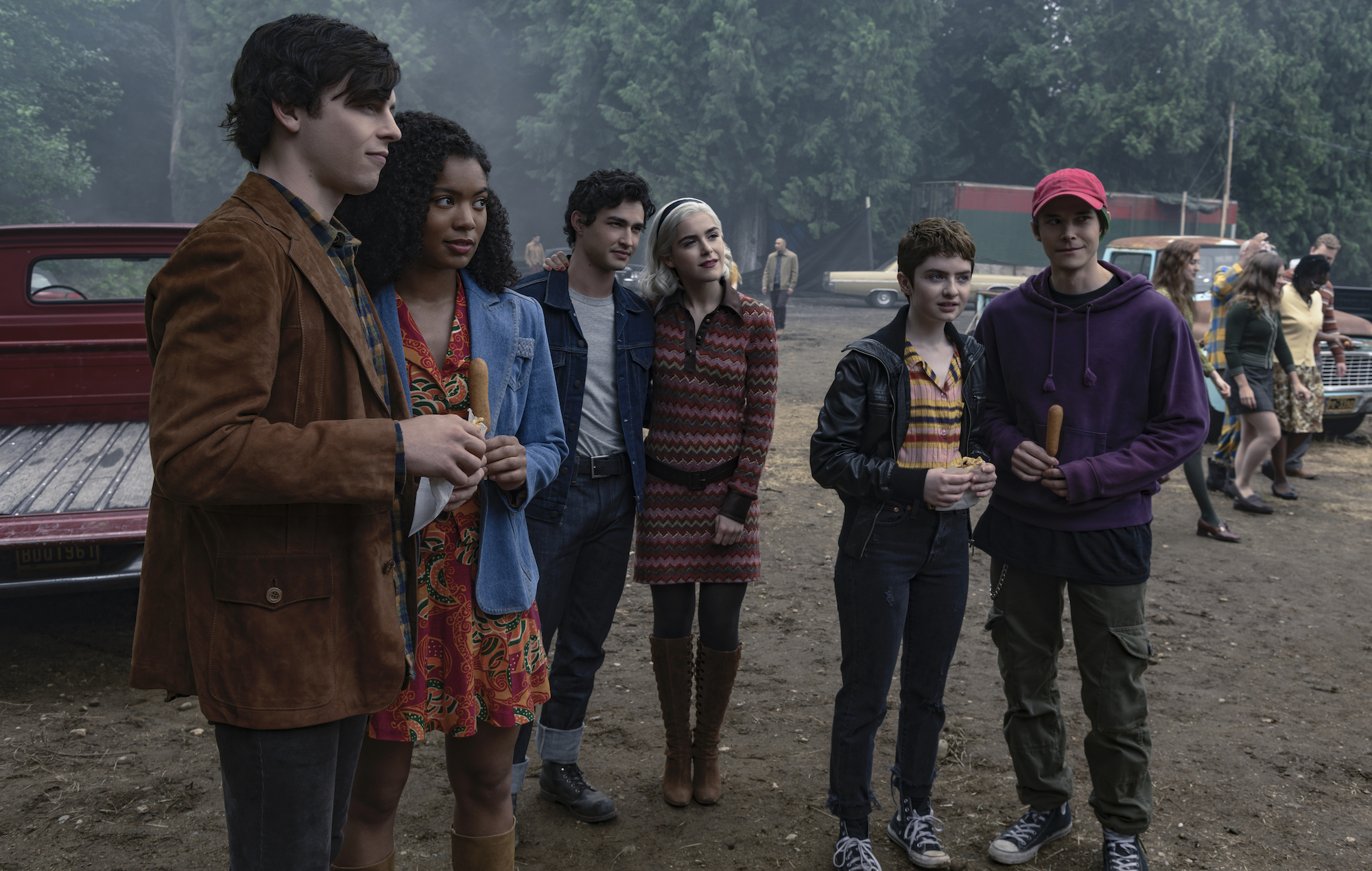 Sabrina Spellman and friends at an outdoor gathering HD Wallpaper