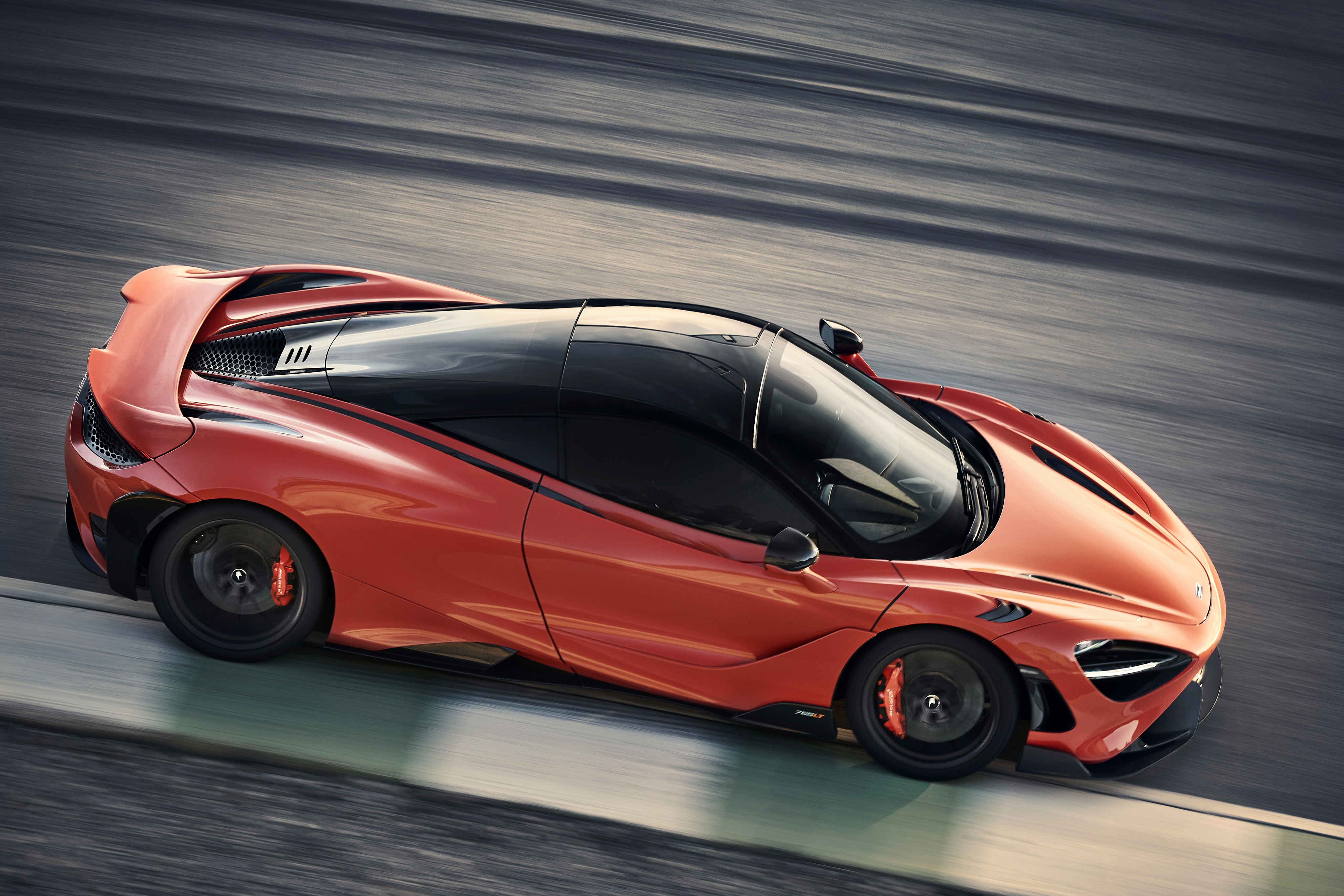 McLaren 765LT Supercar on a Racetrack HD Wallpaper