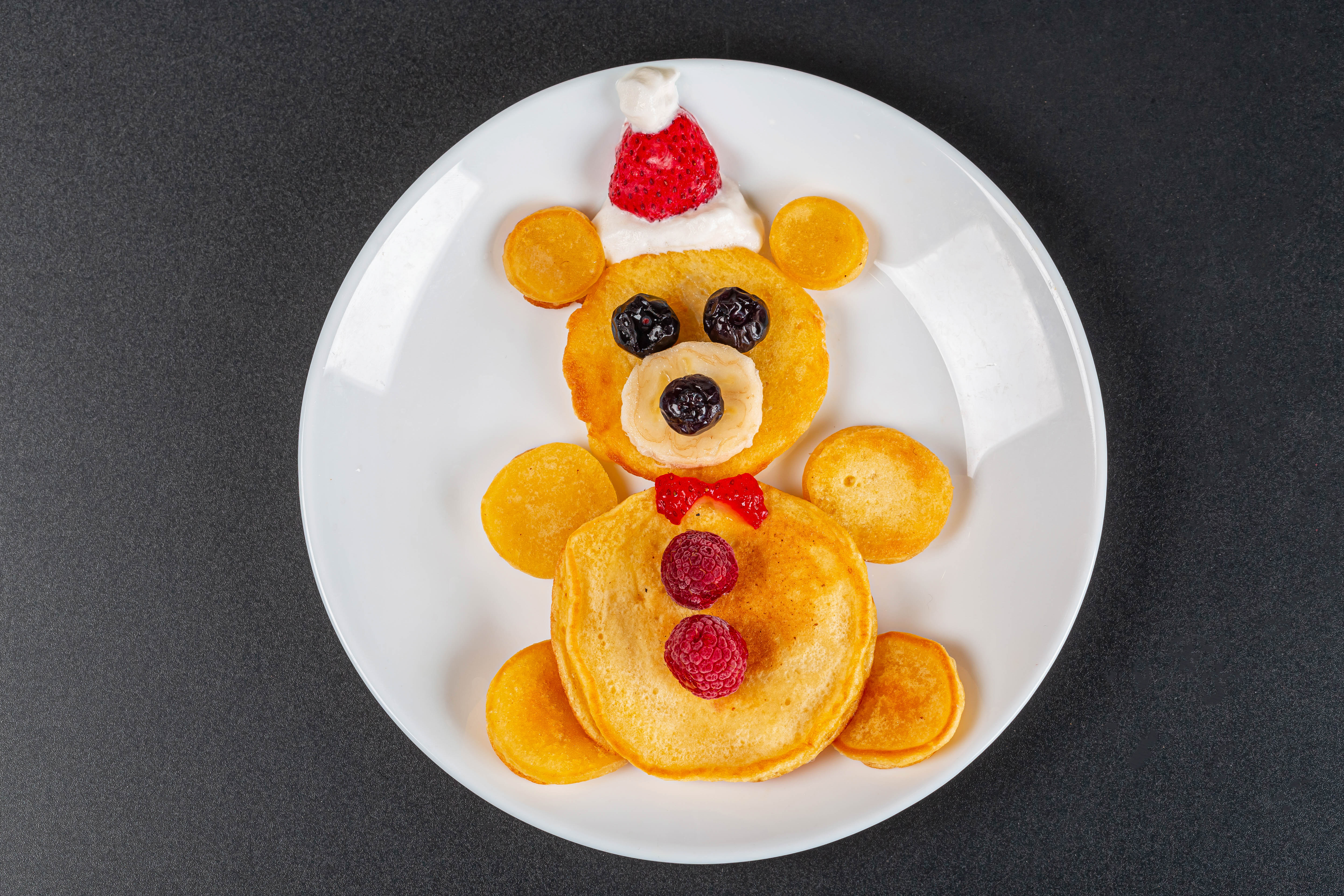 Bear-shaped pancakes with fruit and whipped cream HD Wallpaper
