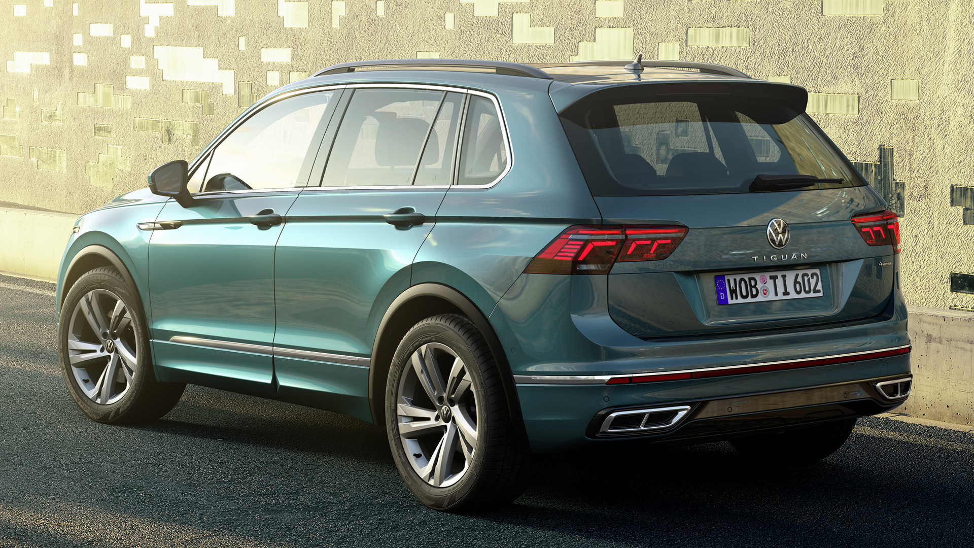 Volkswagen Tiguan R-Line SUV parked by a textured wall HD Wallpaper