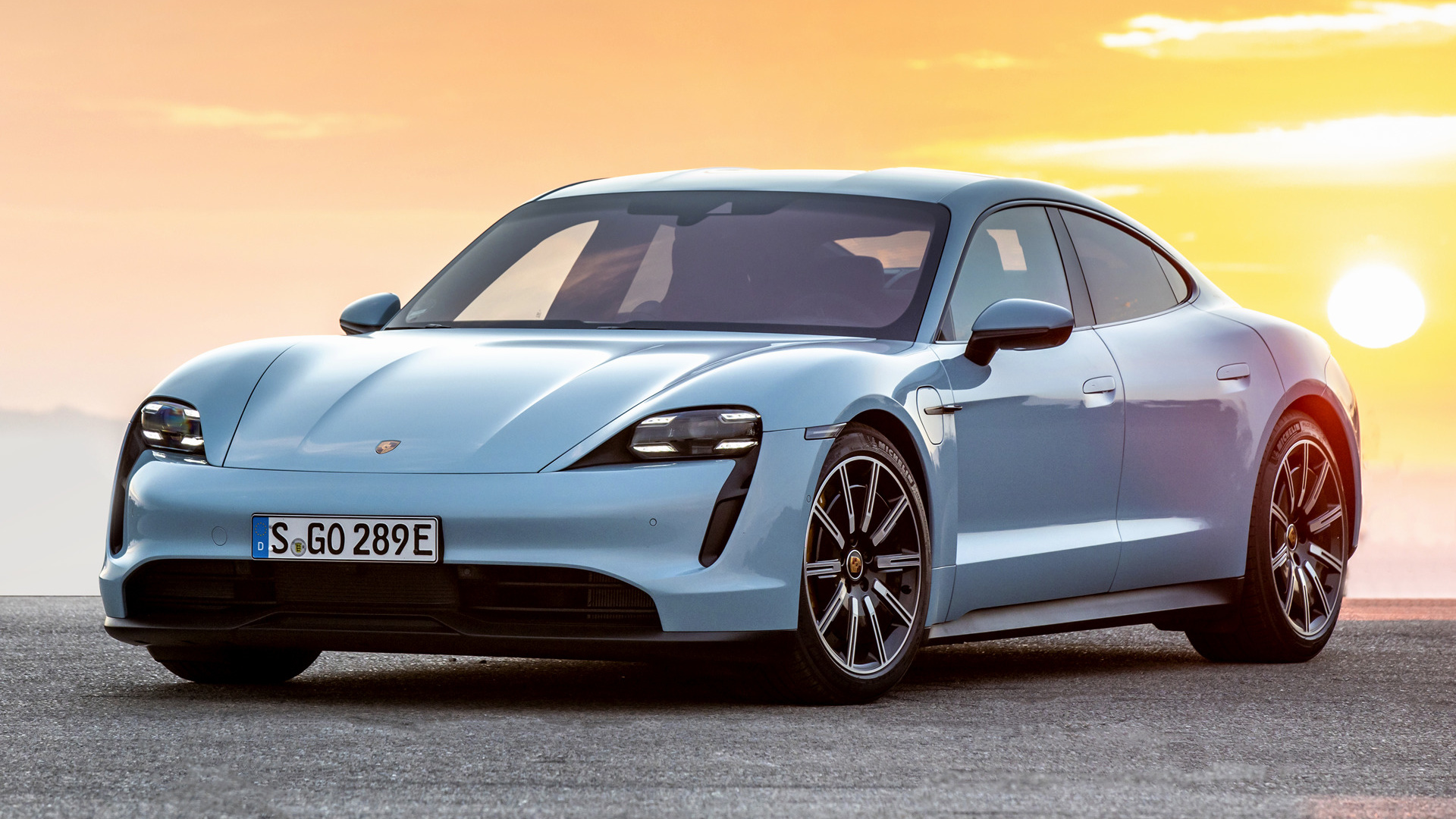 Blue Porsche Taycan 4S electric sedan at sunset HD Wallpaper