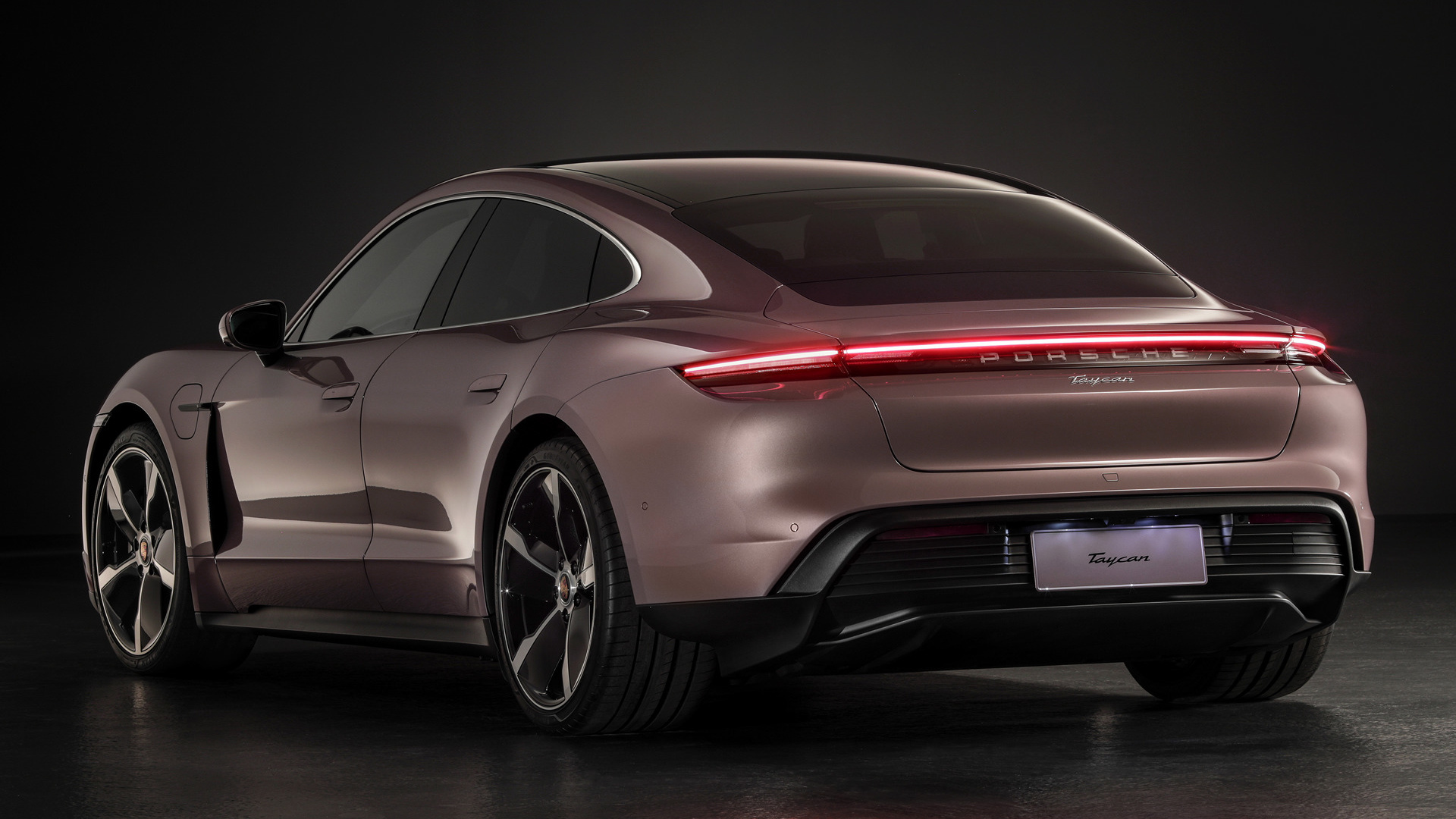 Rear view of a brown 2020 Porsche Taycan electric sedan HD Wallpaper
