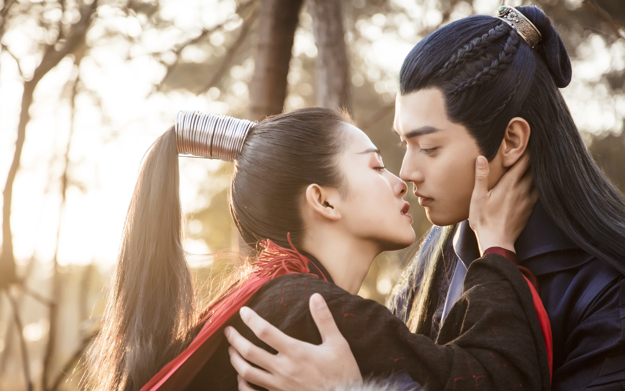 Couple in traditional Chinese attire in a forest HD Wallpaper