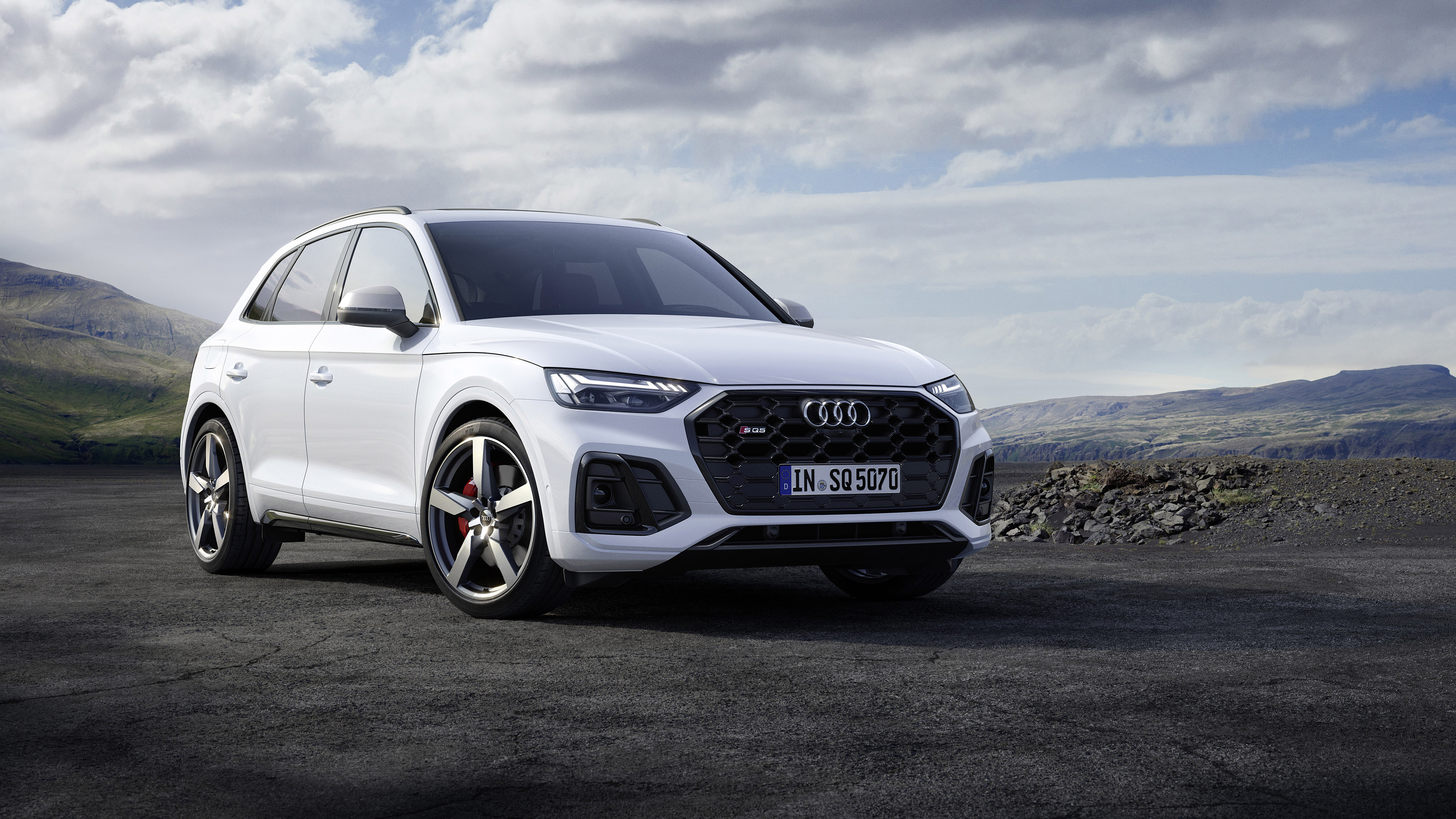 White Audi SQ5 SUV on a rocky landscape HD Wallpaper