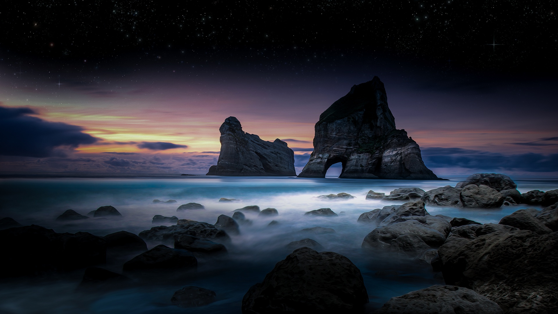 Rock formations in the ocean at sunset with stars HD Wallpaper