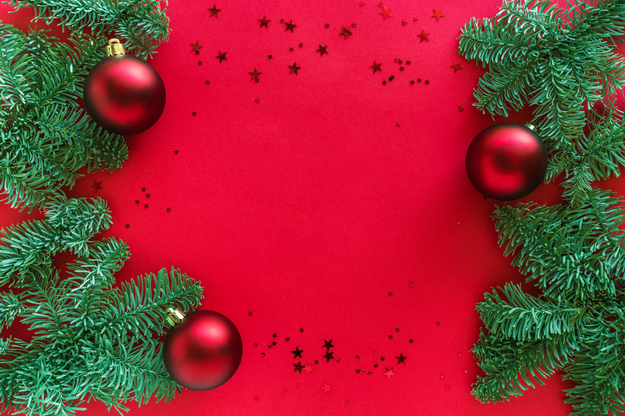 Christmas tree branches with red ornaments and stars HD Wallpaper