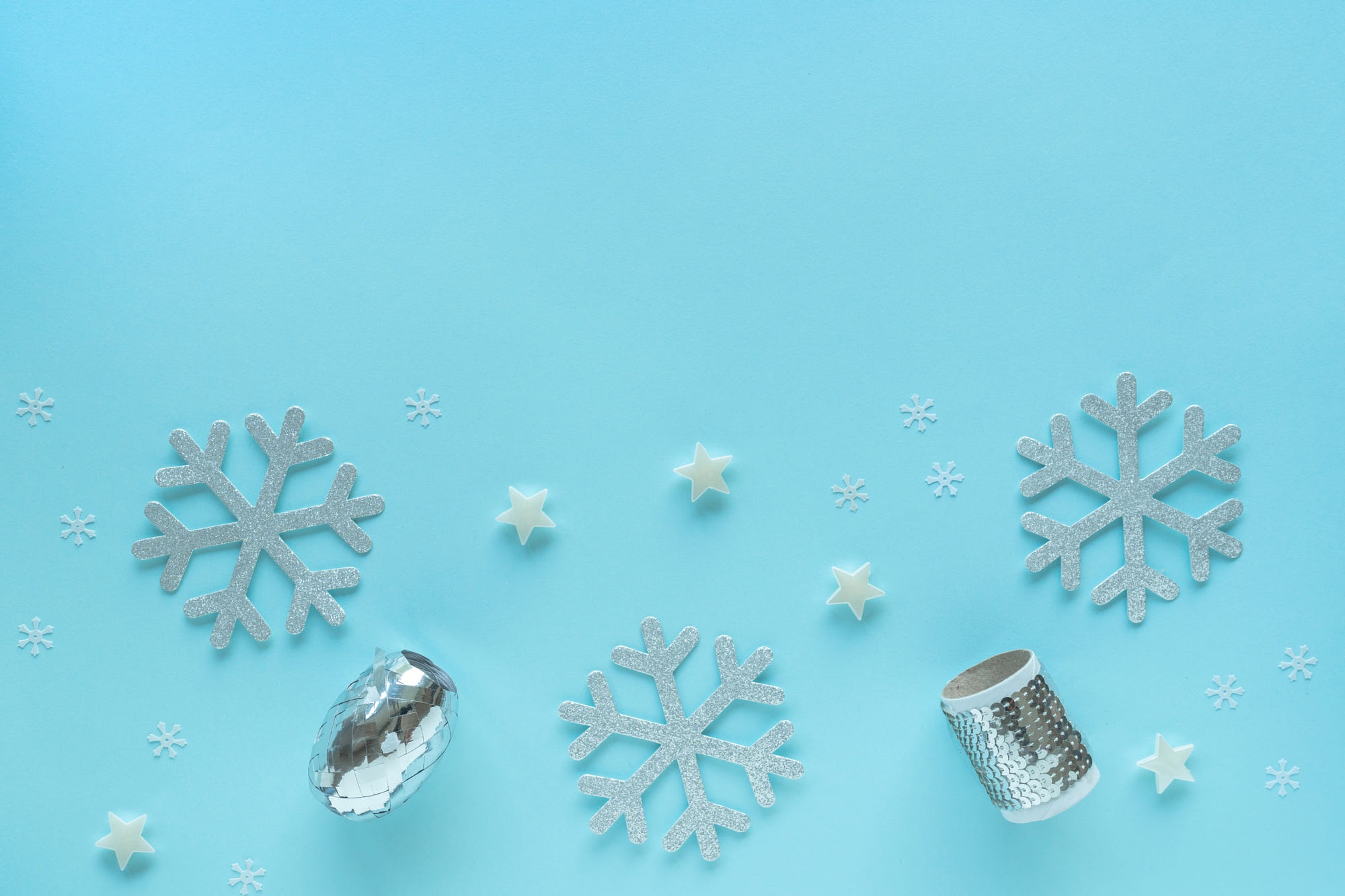 Silver snowflakes and stars on a blue background HD Wallpaper