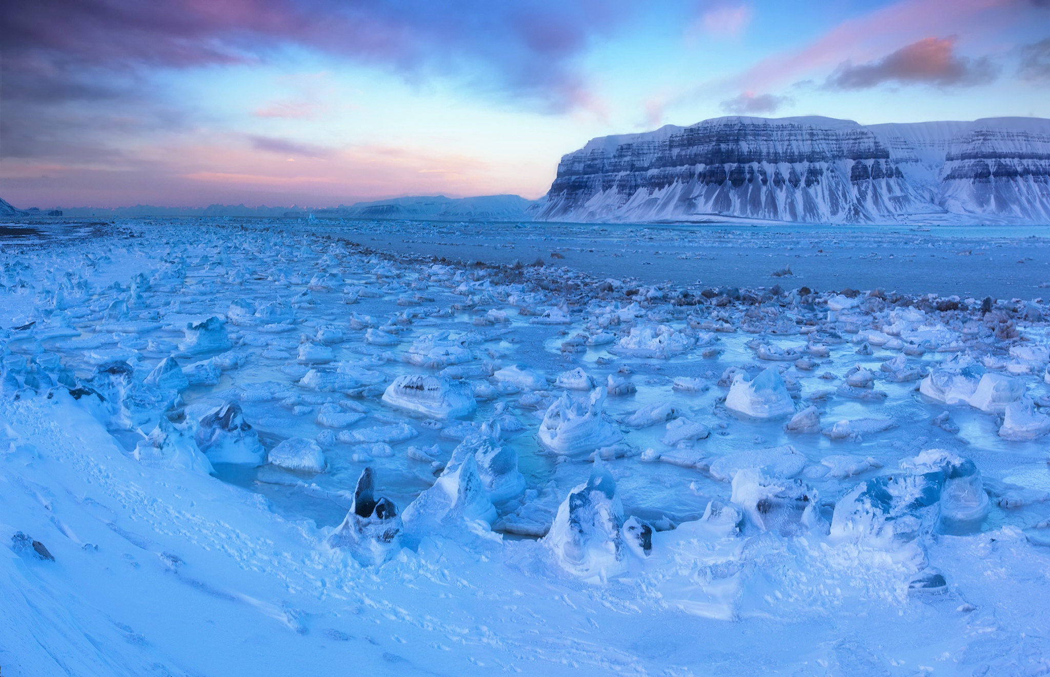 Ice floes and mountains at sunset HD Wallpaper