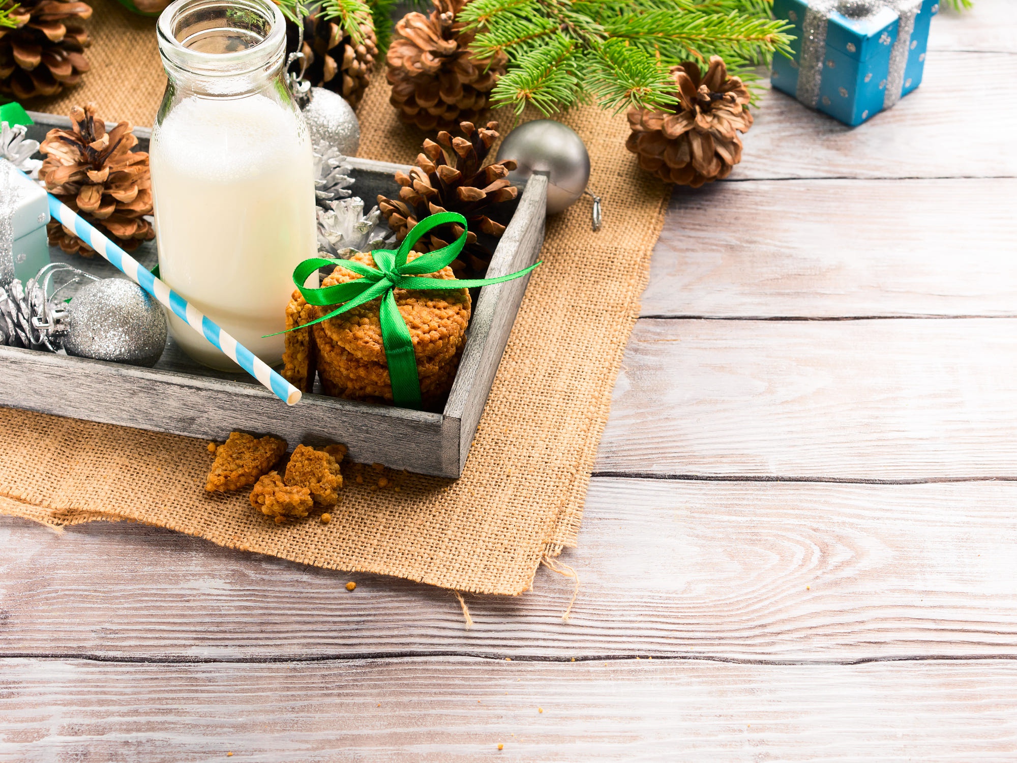Christmas cookies and milk on a tray with pine cones HD Wallpaper