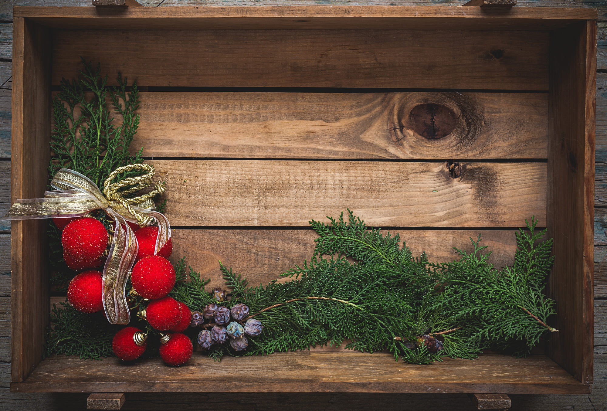 Christmas Ornaments and Festive Greenery in Wooden Crate HD Wallpaper