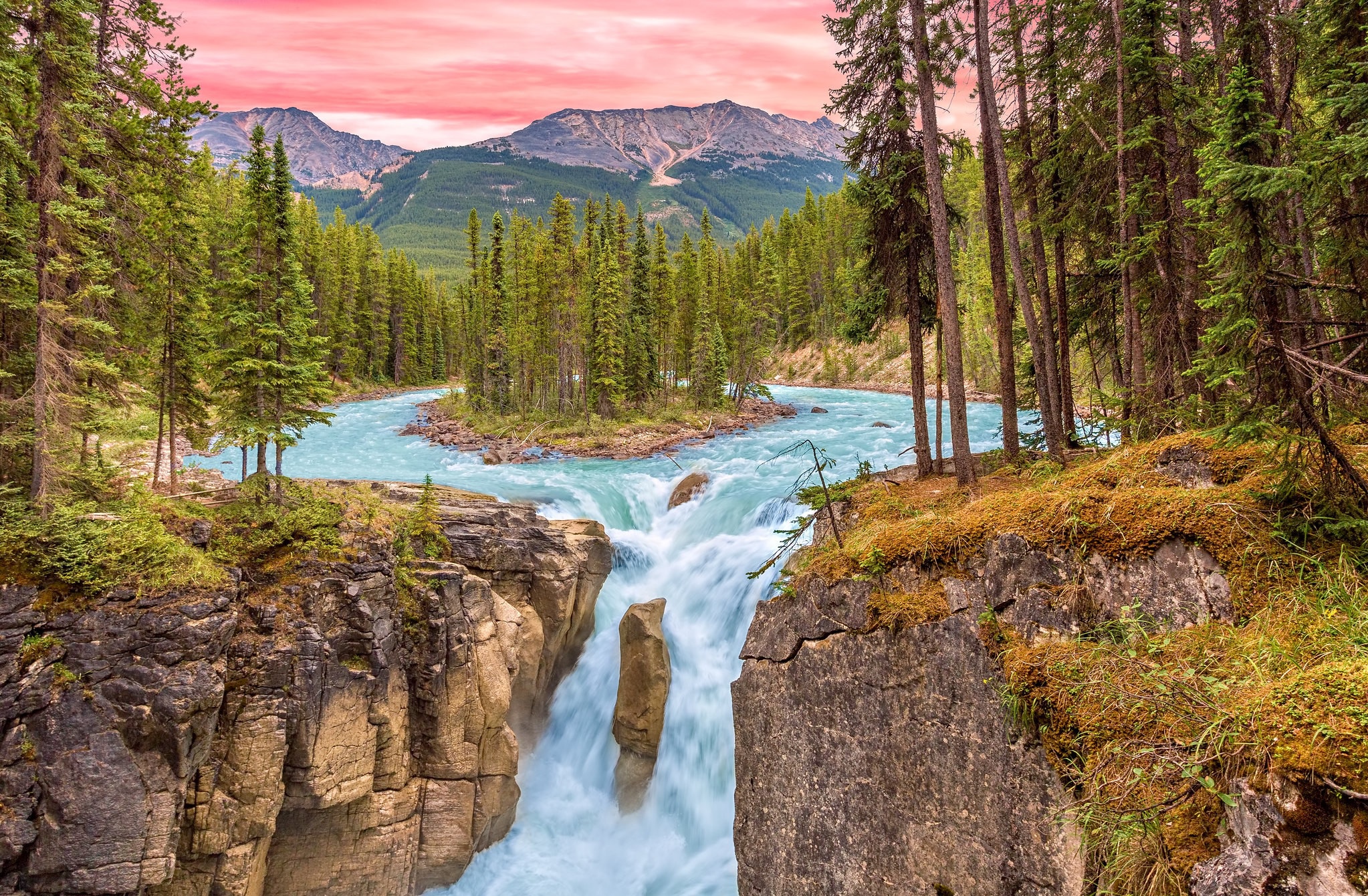 Waterfall in a forest with mountains and a river HD Wallpaper