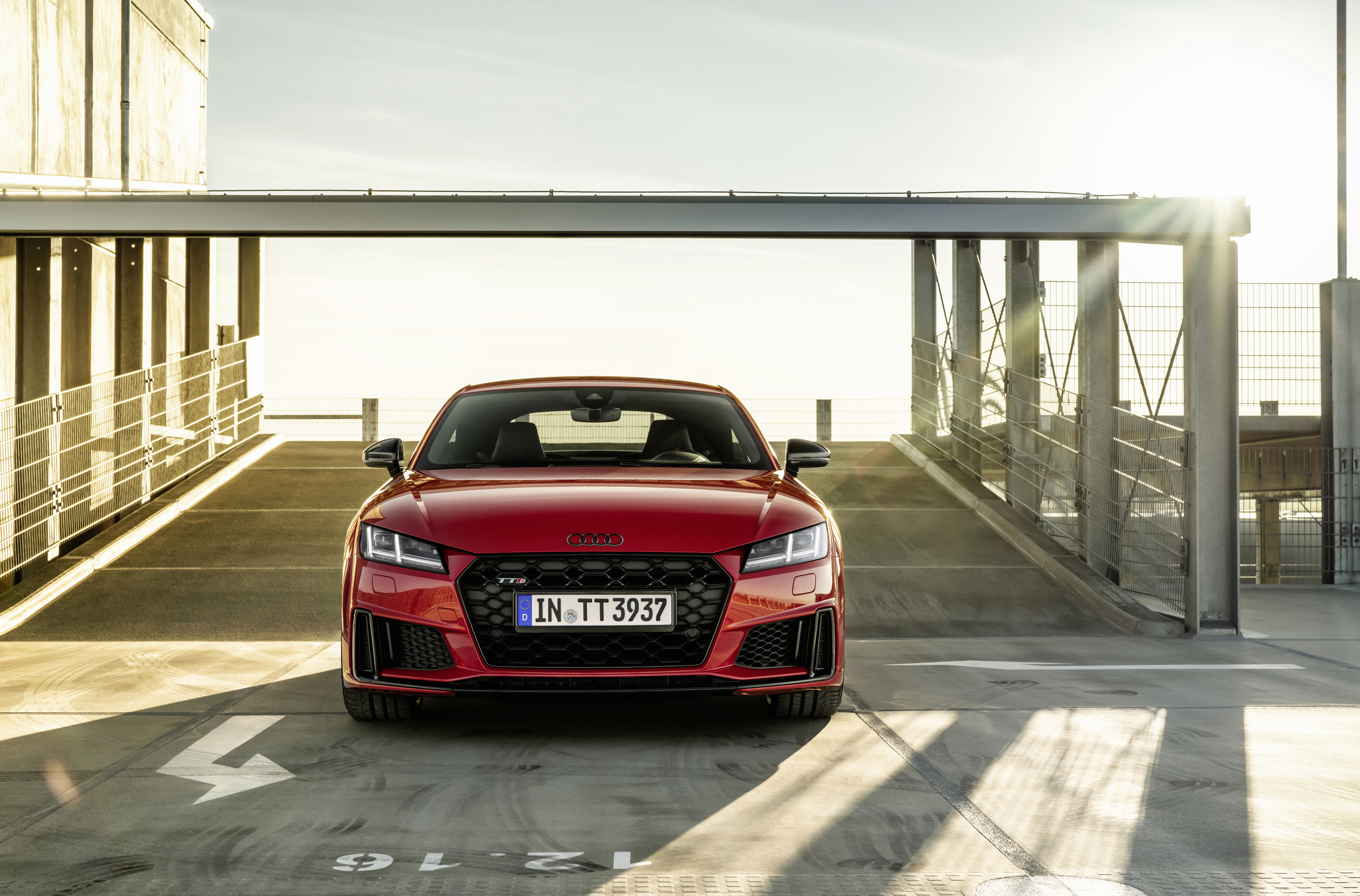 Red Audi TT RS parked under a canopy HD Wallpaper