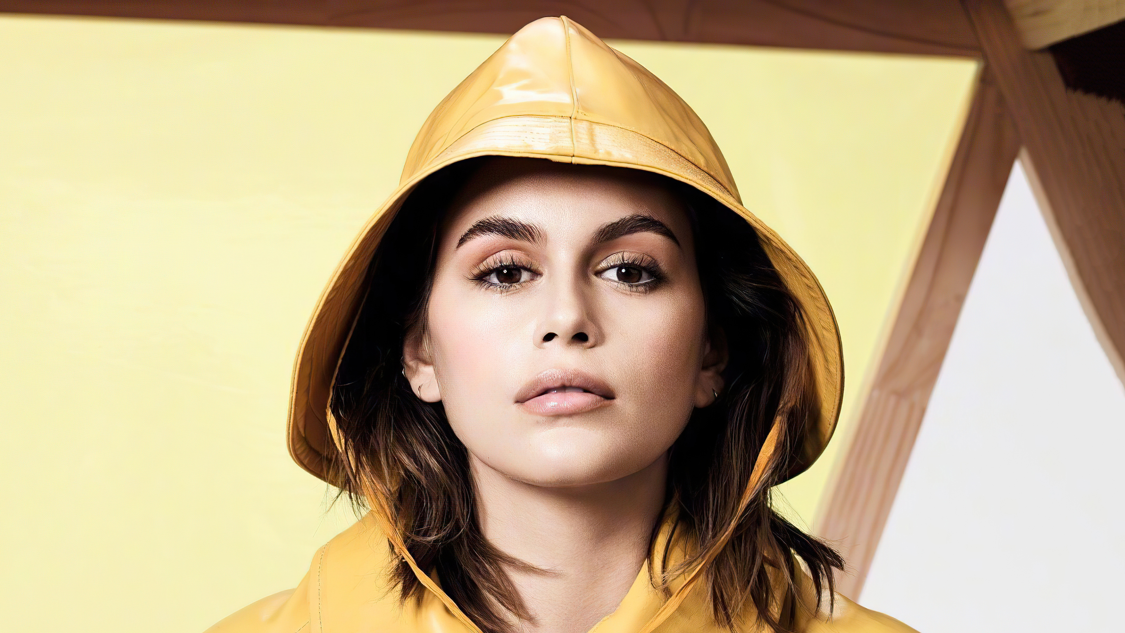 Kaia Gerber wearing a yellow rain hat HD Wallpaper
