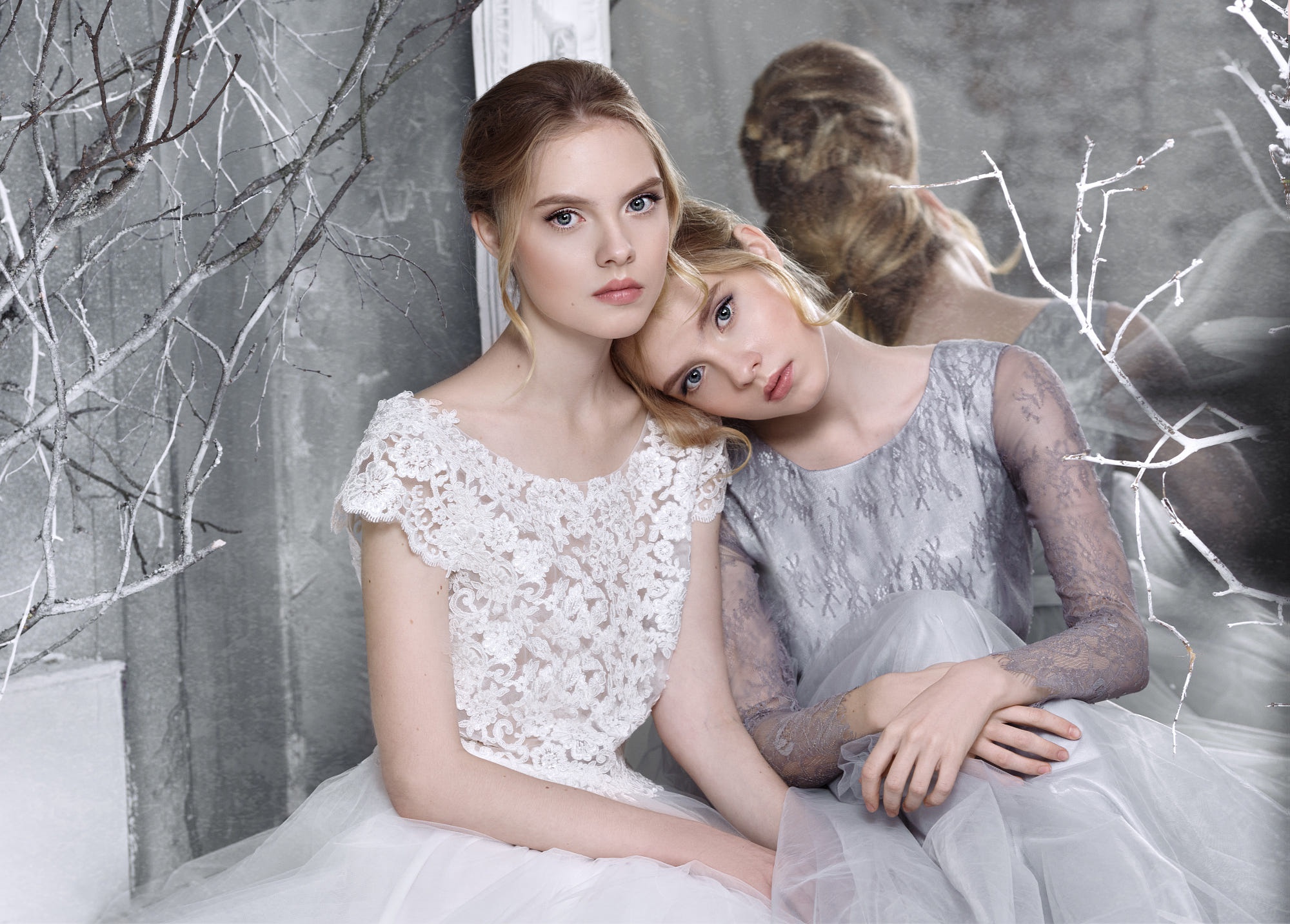Two blonde women in dresses, one white, one grey HD Wallpaper
