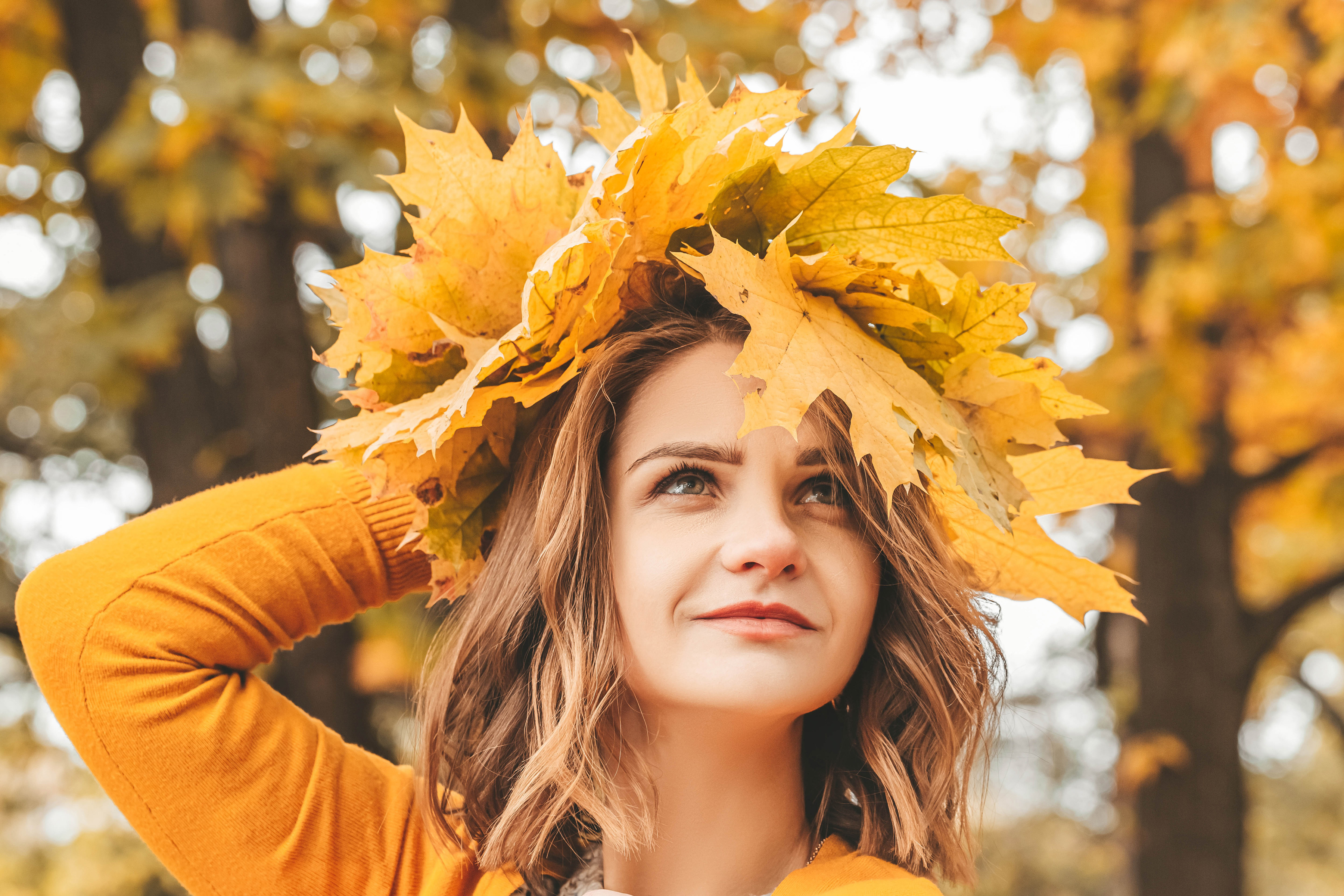 Woman wearing a crown of autumn leaves HD Wallpaper