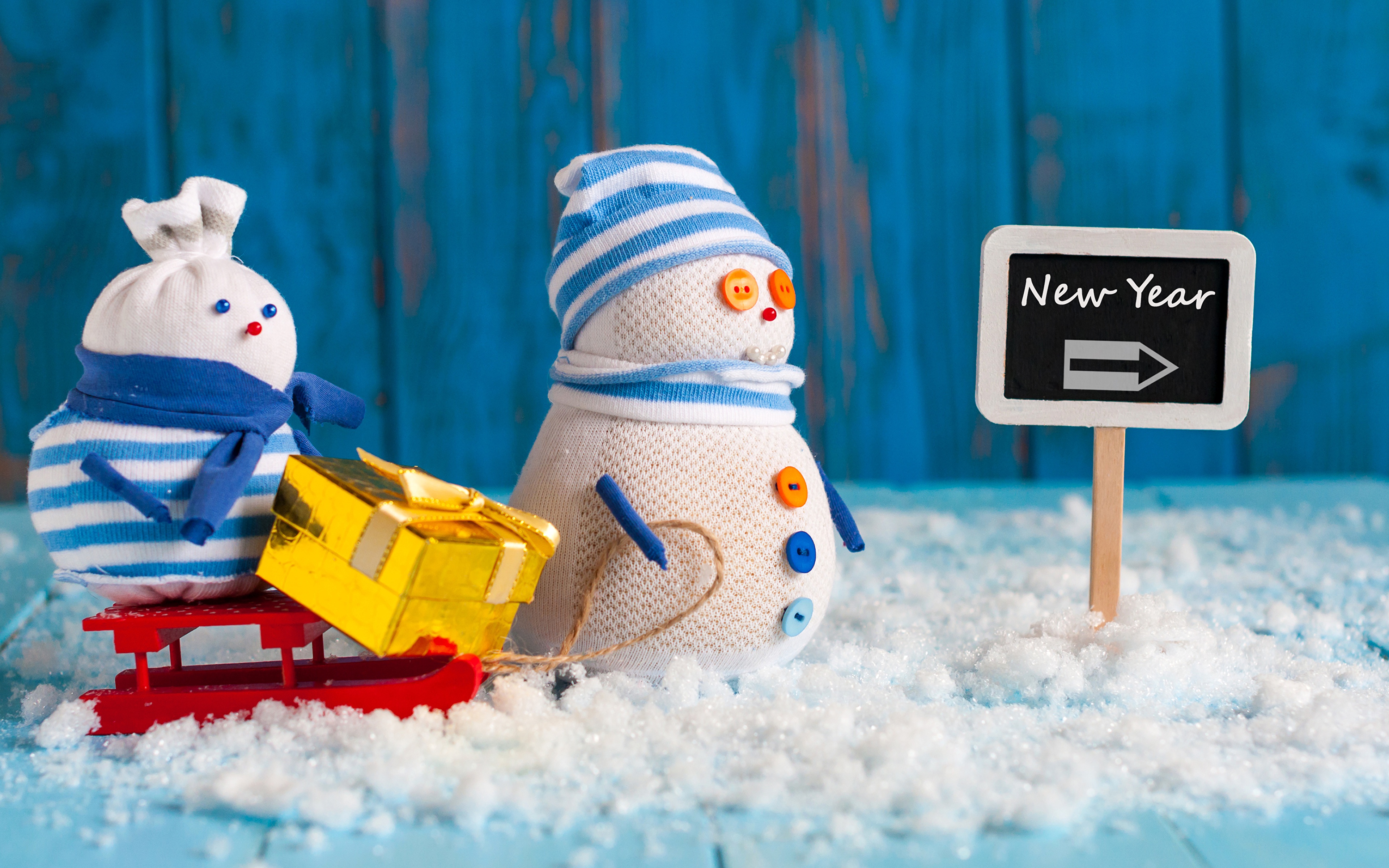 New Year Snowmen with Gift on Sled HD Wallpaper